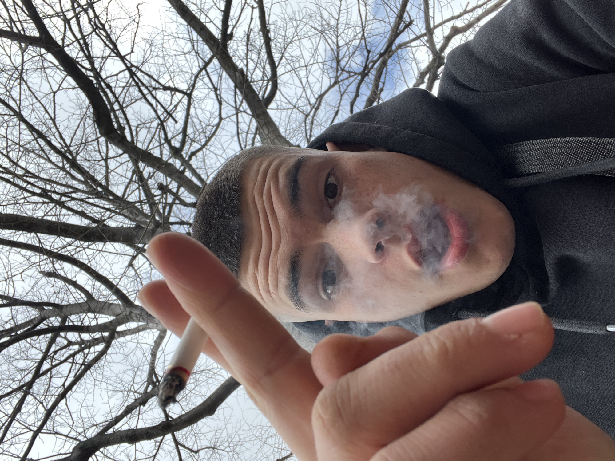 Two men smoking outdoors in Sopot, Bulgaria
