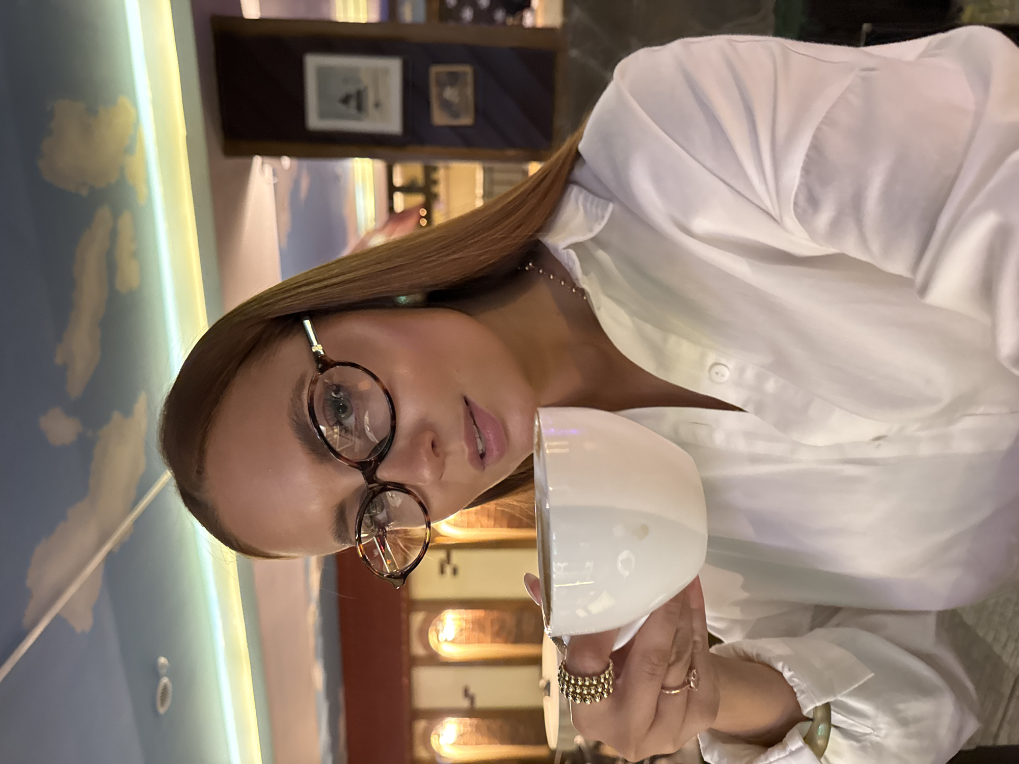 Woman enjoys coffee break at Chaikovsky café