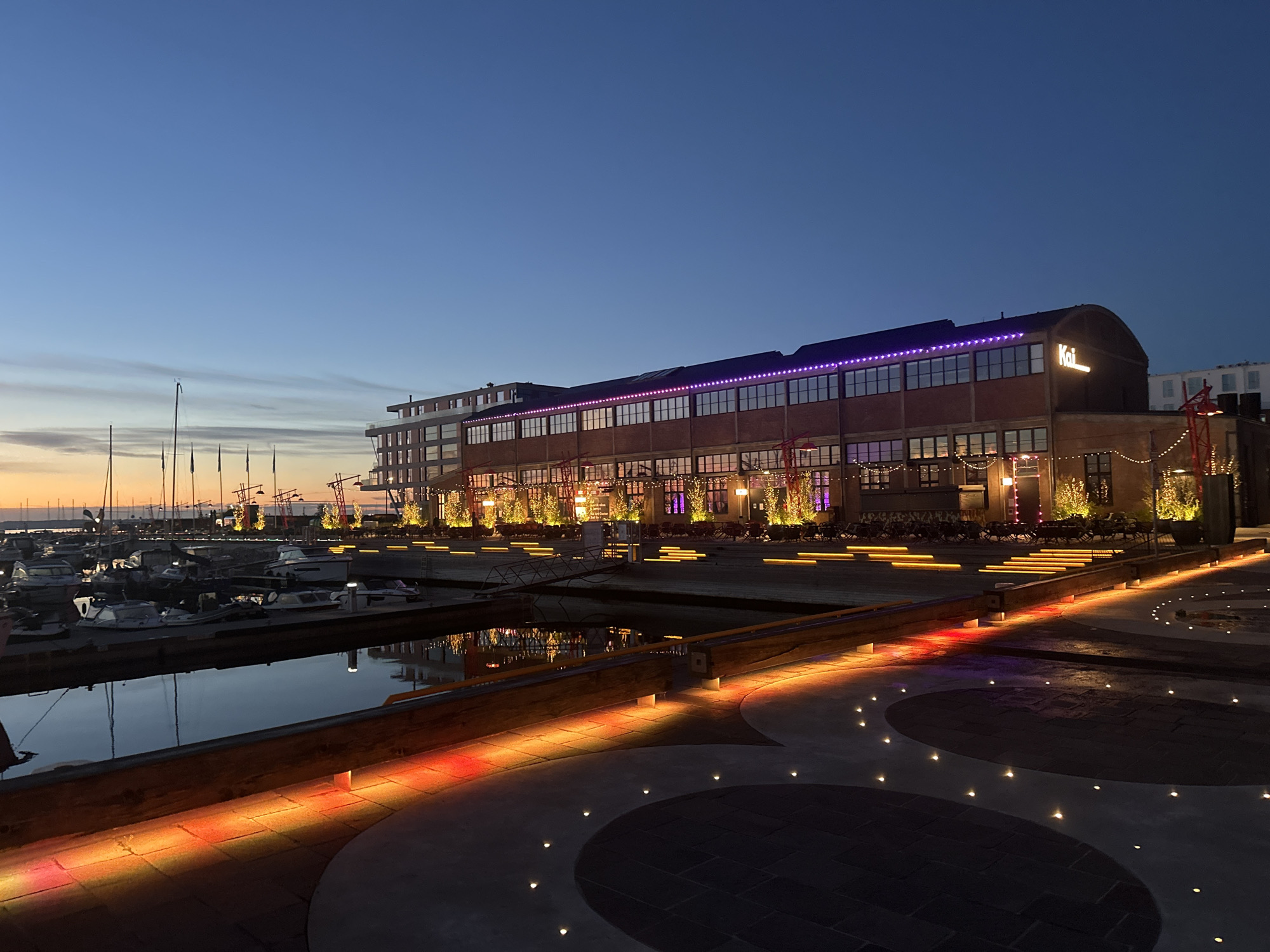 Tallinn waterfront at dusk, marinas and promenades glowing