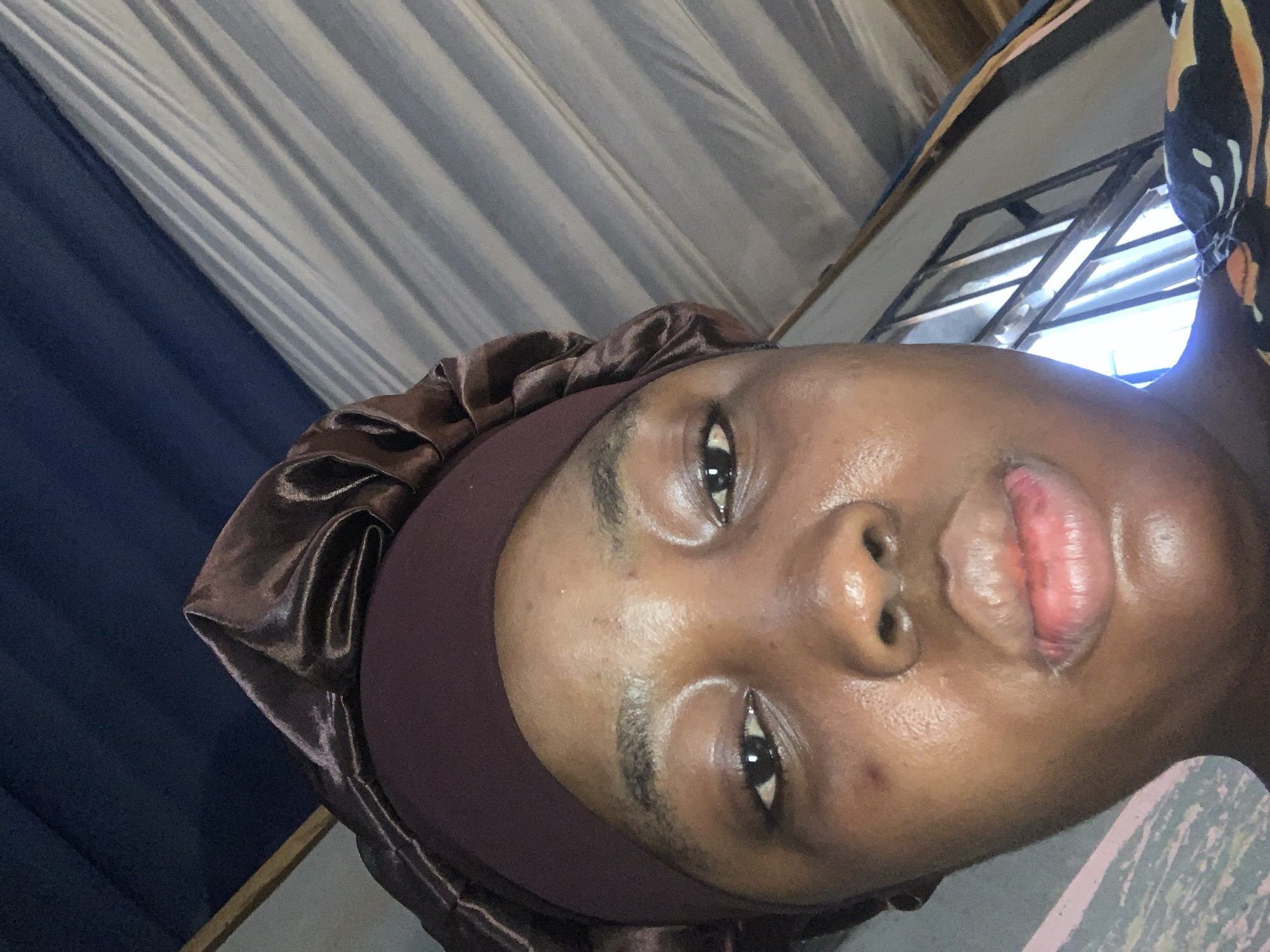 Person in traditional head covering photographed in Aba, Nigeria