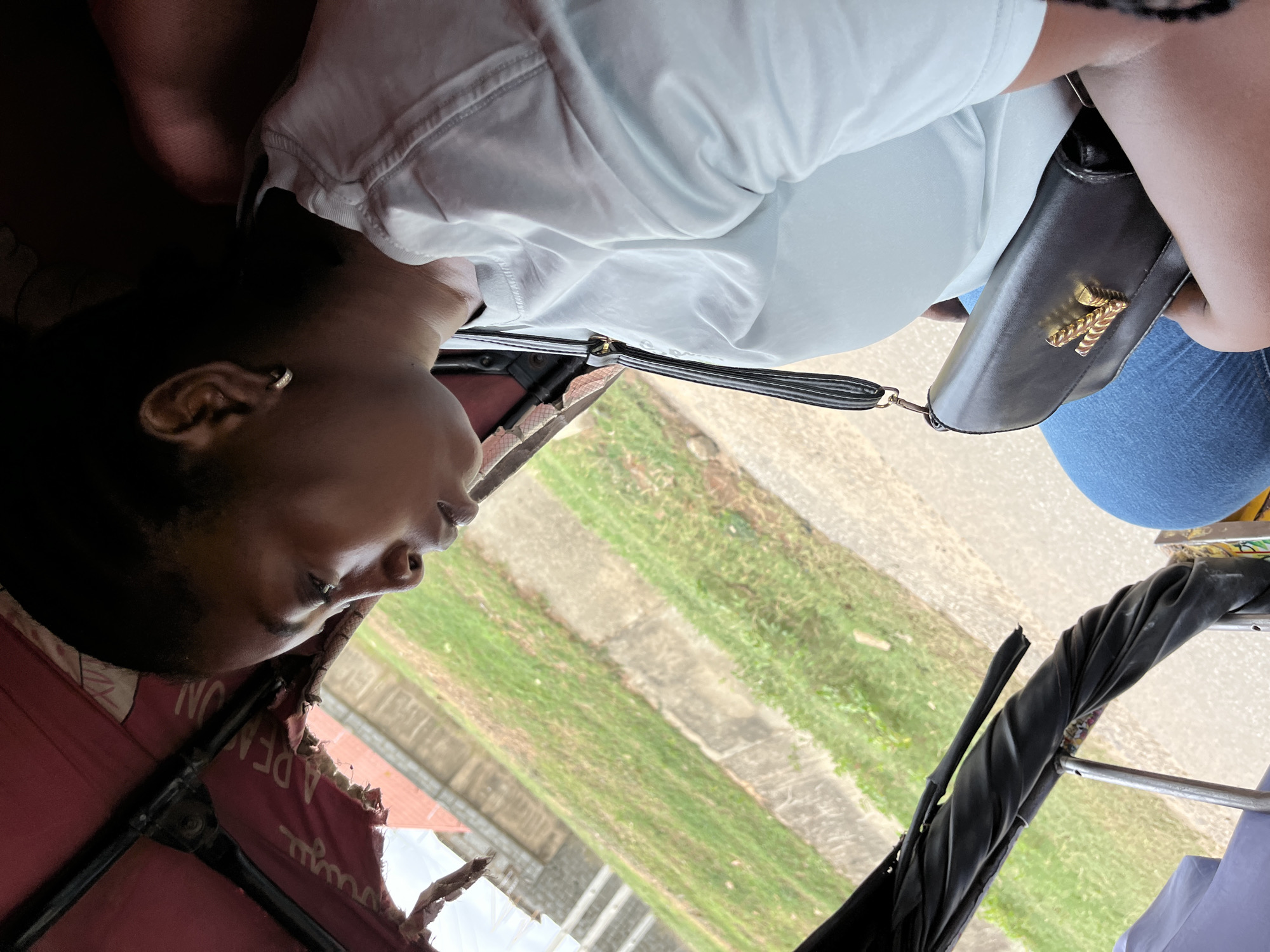 Passengers ride tricycle taxi through Abuja area Thursday morning