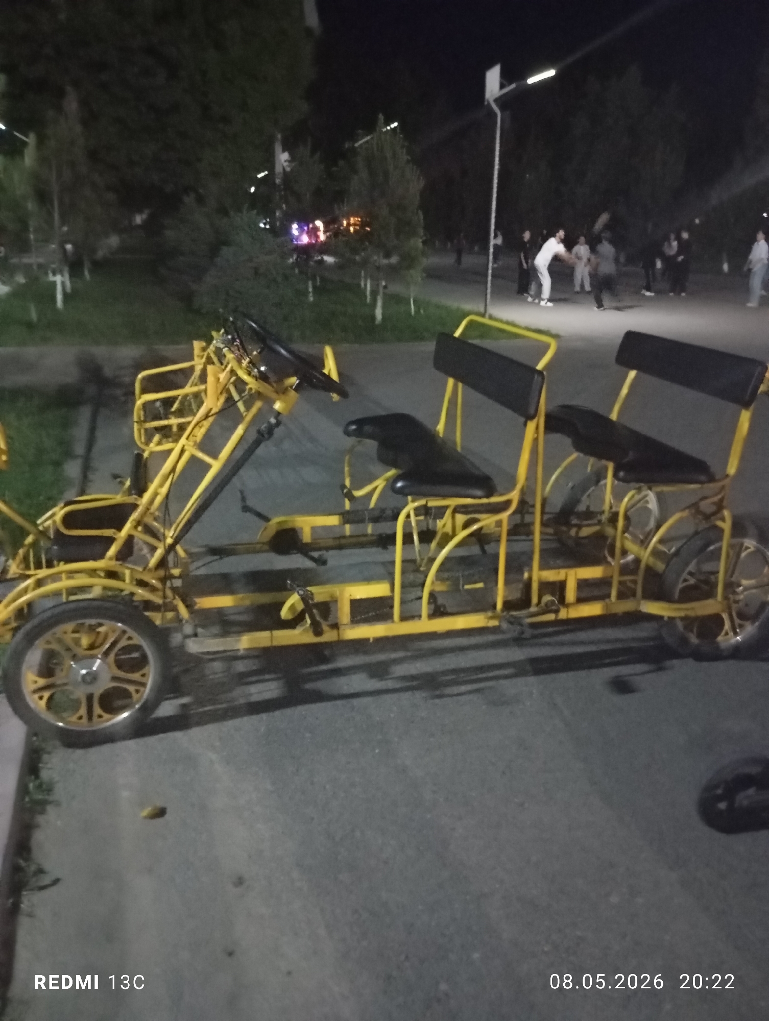 Yellow quadricycle spotted on nighttime street in Gazalkent, Uzbekistan