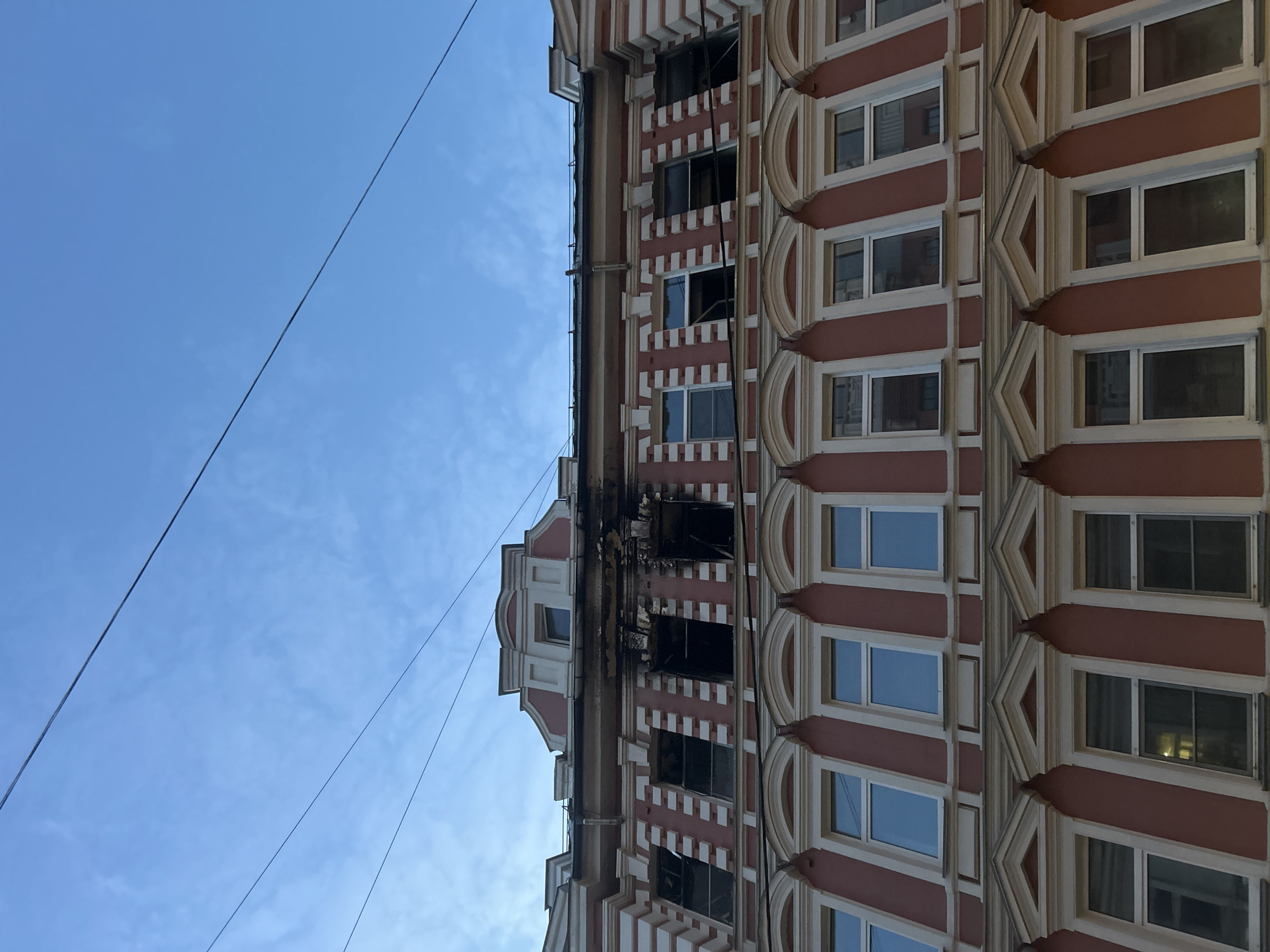 Fire-damaged ornate building photographed in Moscow