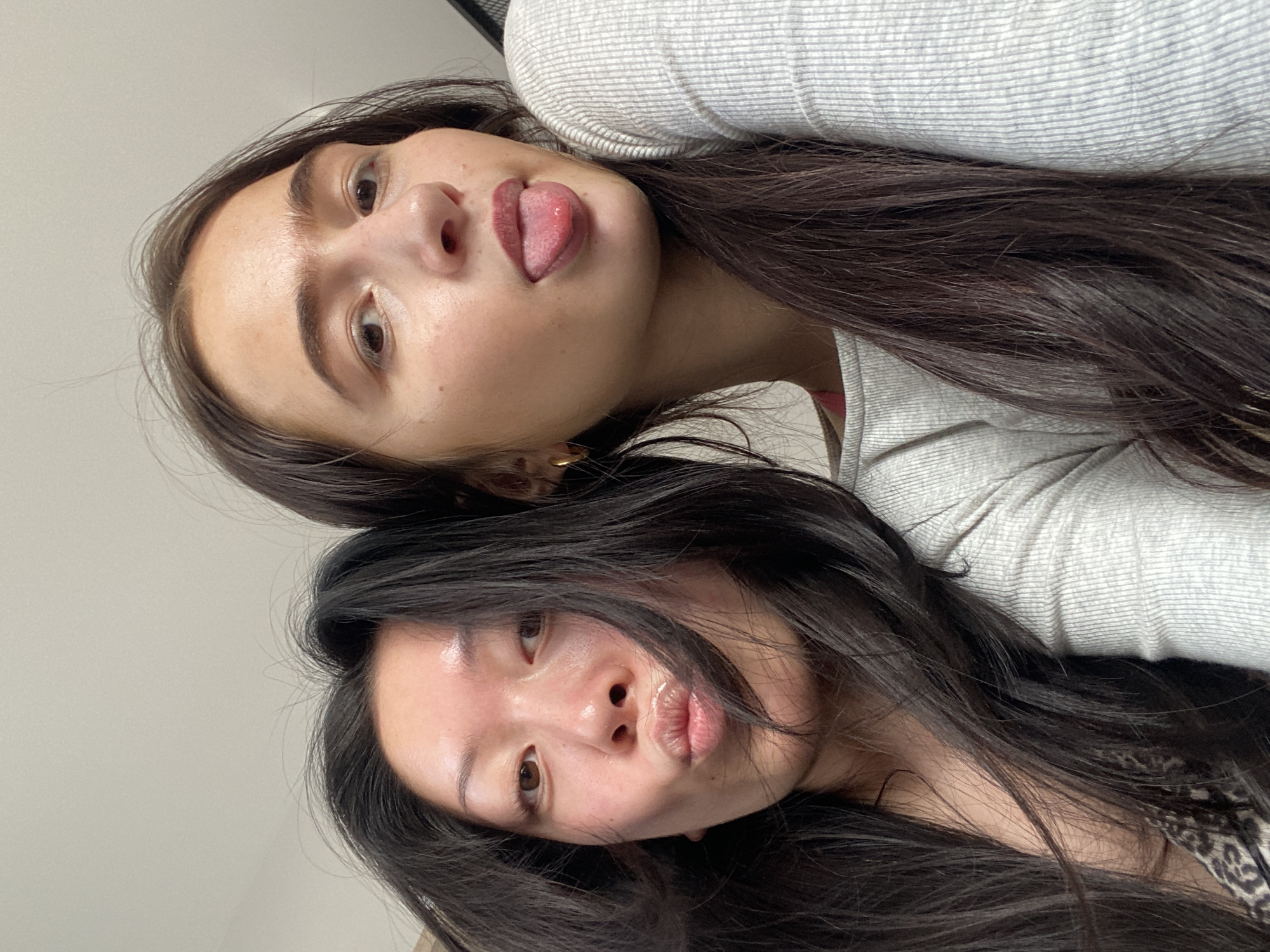 Two women pose for playful photo in London