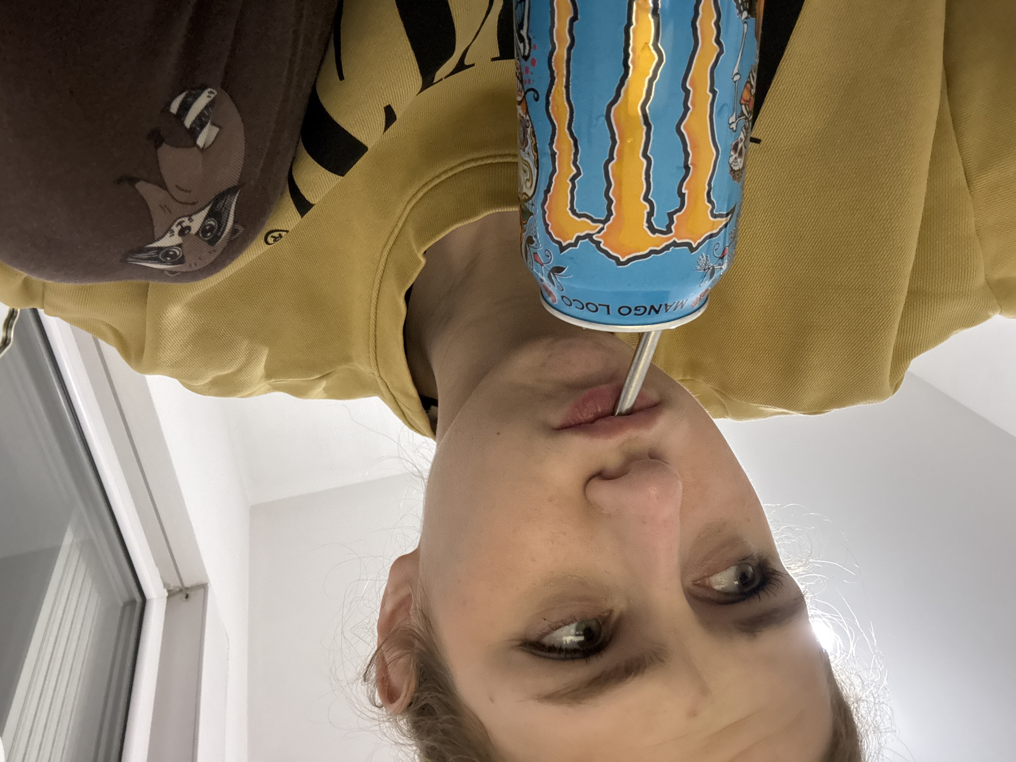Person drinks Monster energy drink in Kragujevac, Serbia