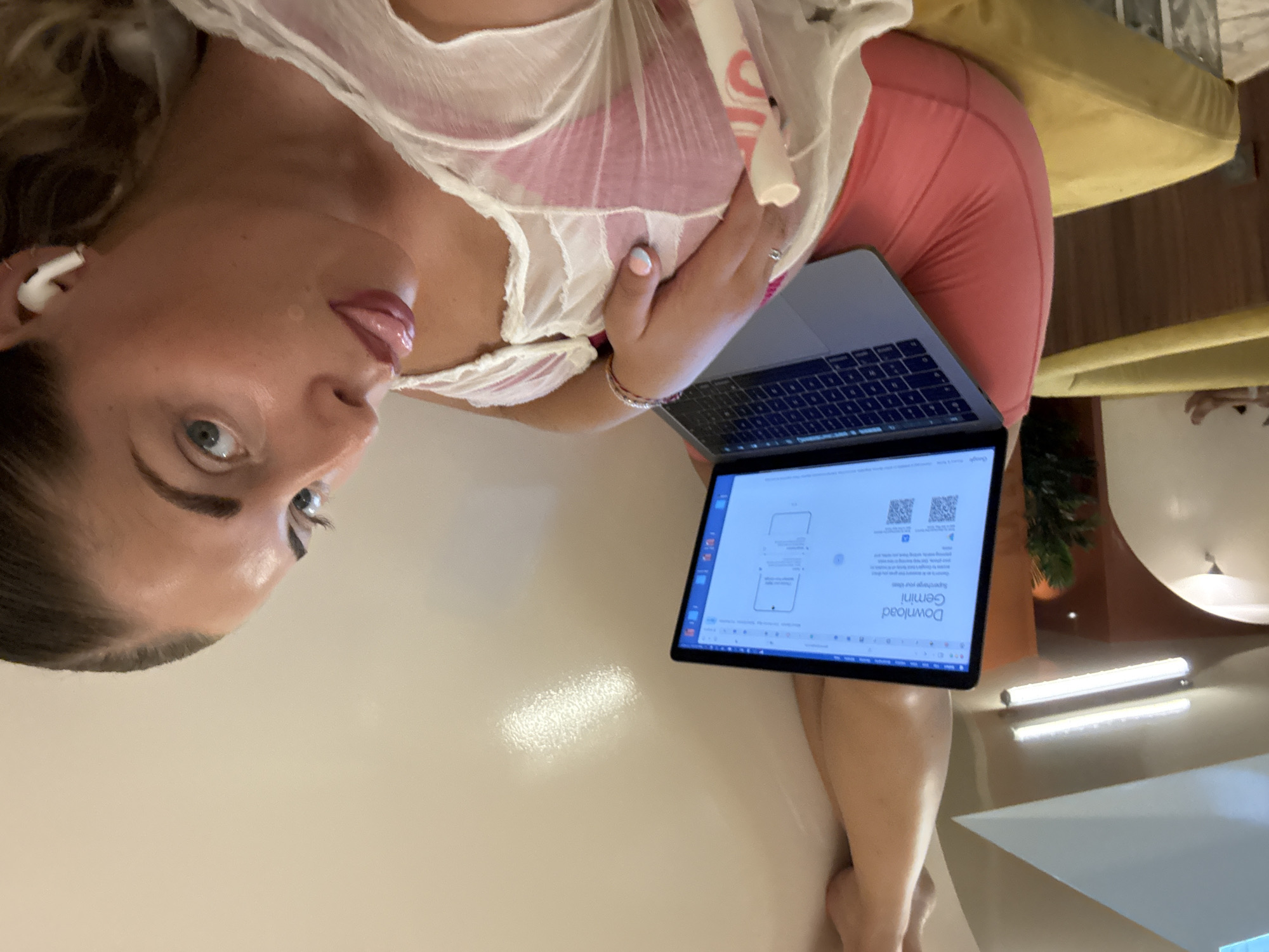 Hot Paris afternoon, yellow couch, laptop open.