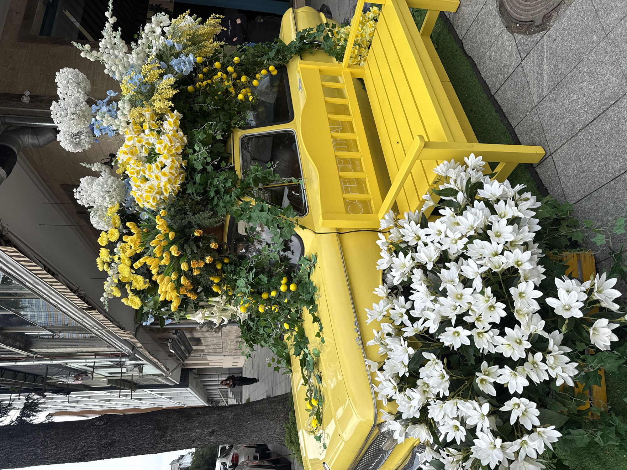Flower-decorated vintage truck spotted on Batumi sidewalk