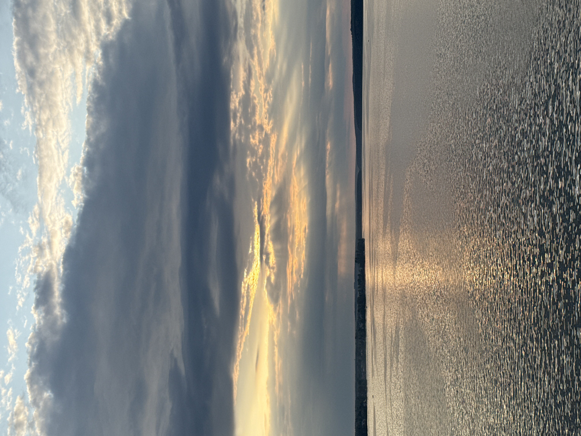 Sunset clouds break over Votkinsk Reservoir from above