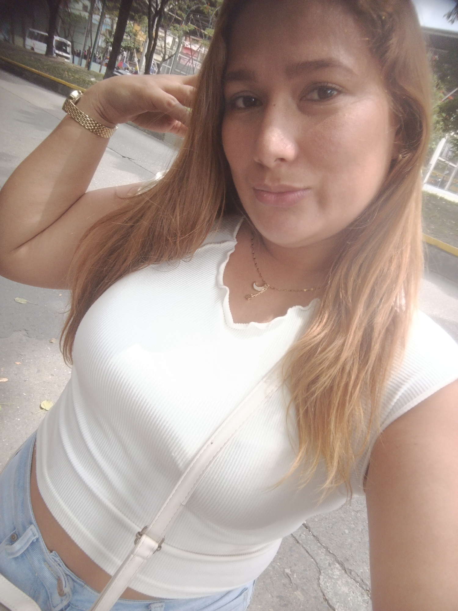 Woman takes selfies in public area of Caracas