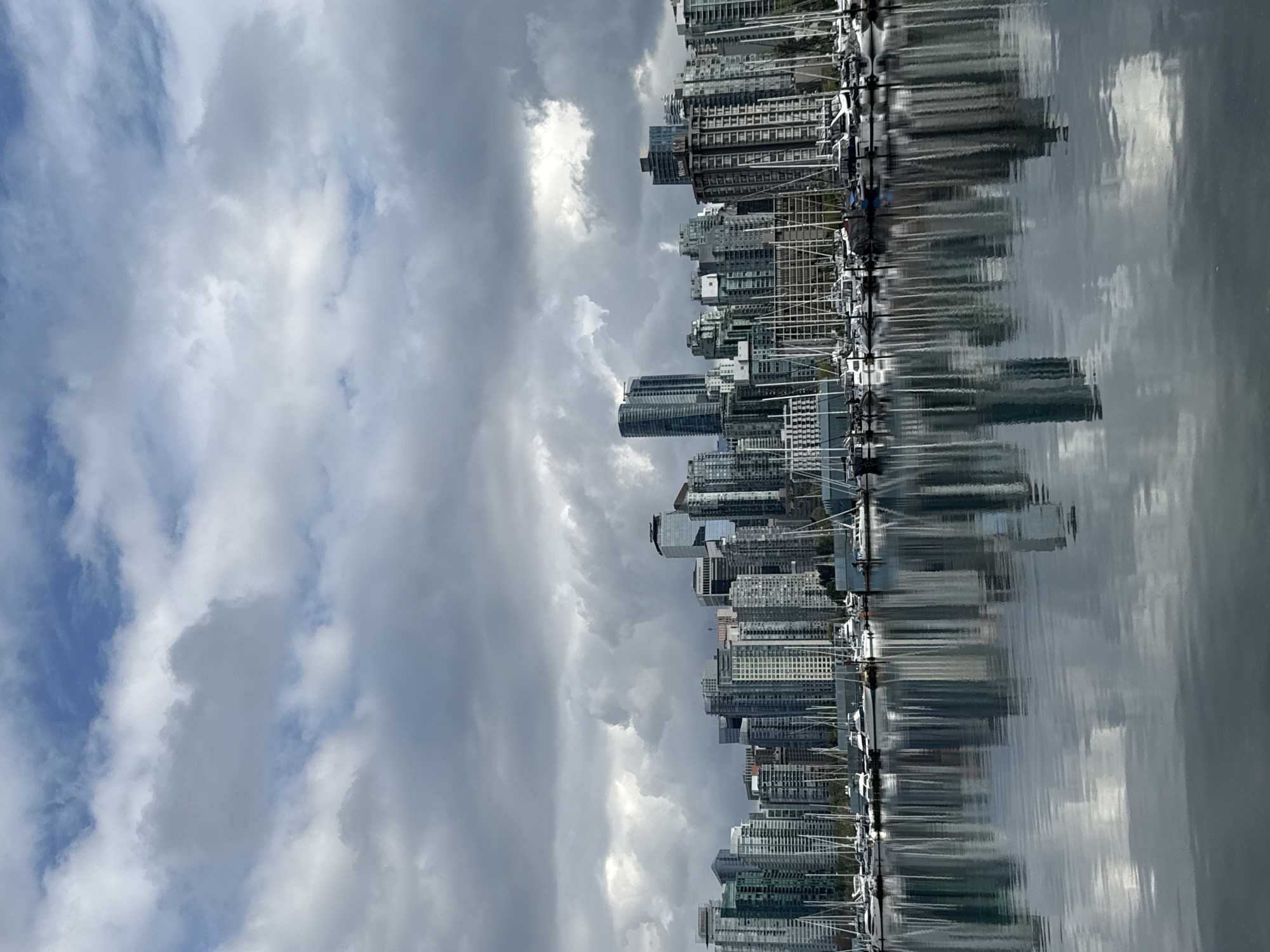 Vancouver waterfront scene captured showing cityscape and marina reflections