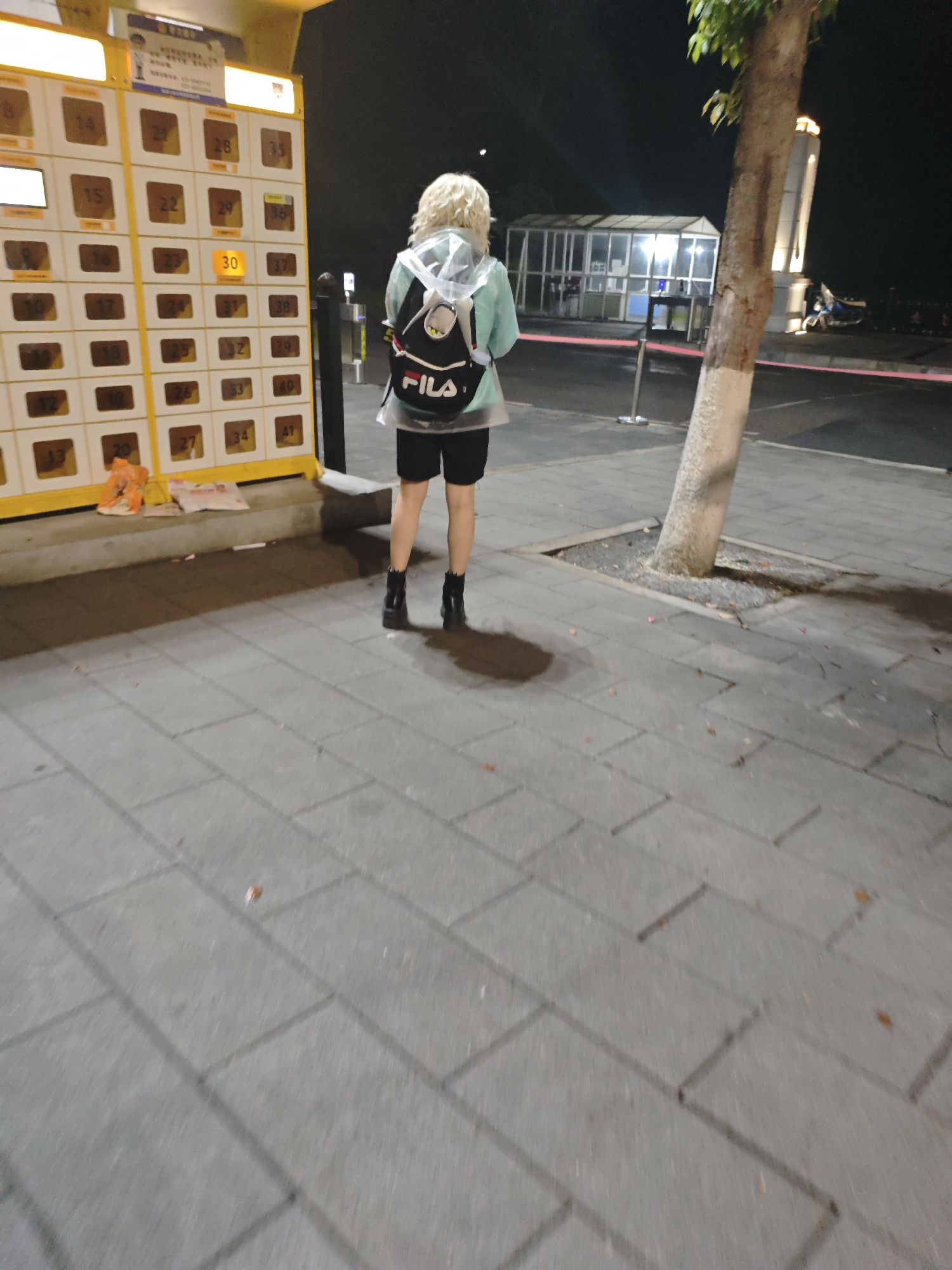 Person spotted standing on pavement in Shapingba District at night