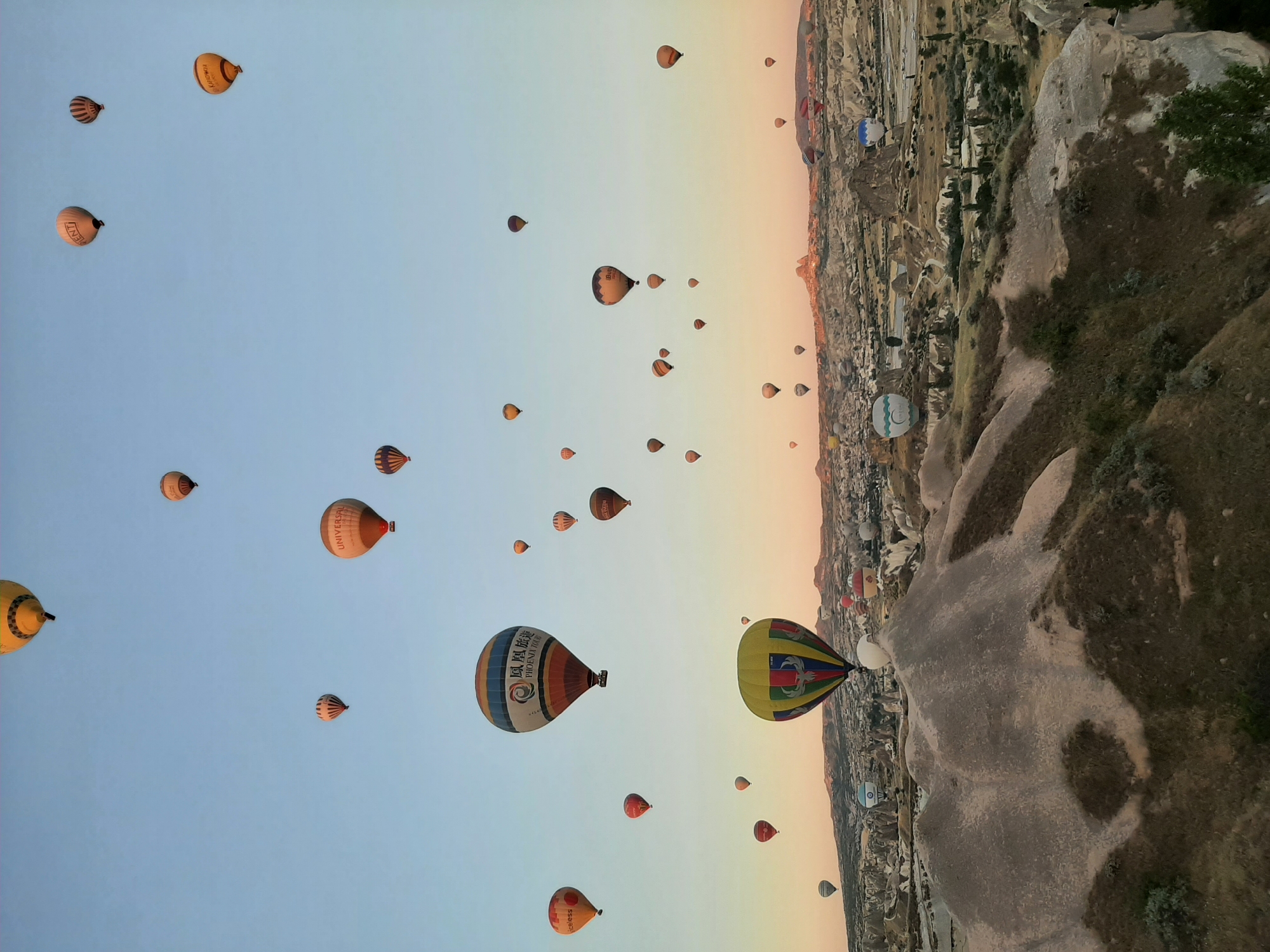 Hot air balloons fill the sky over Avanos at sunrise
