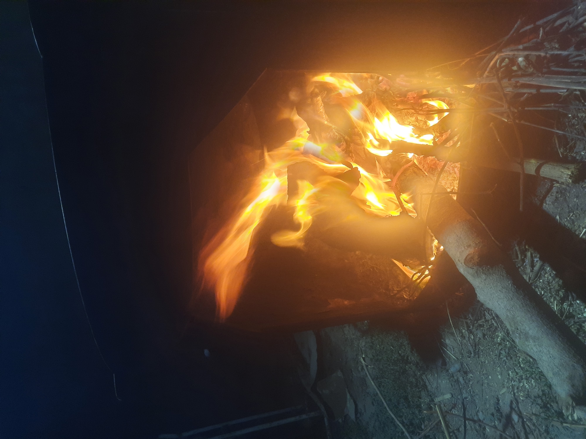 Late-night fire cooking around a kazan in Восеабад, Tajikistan.
