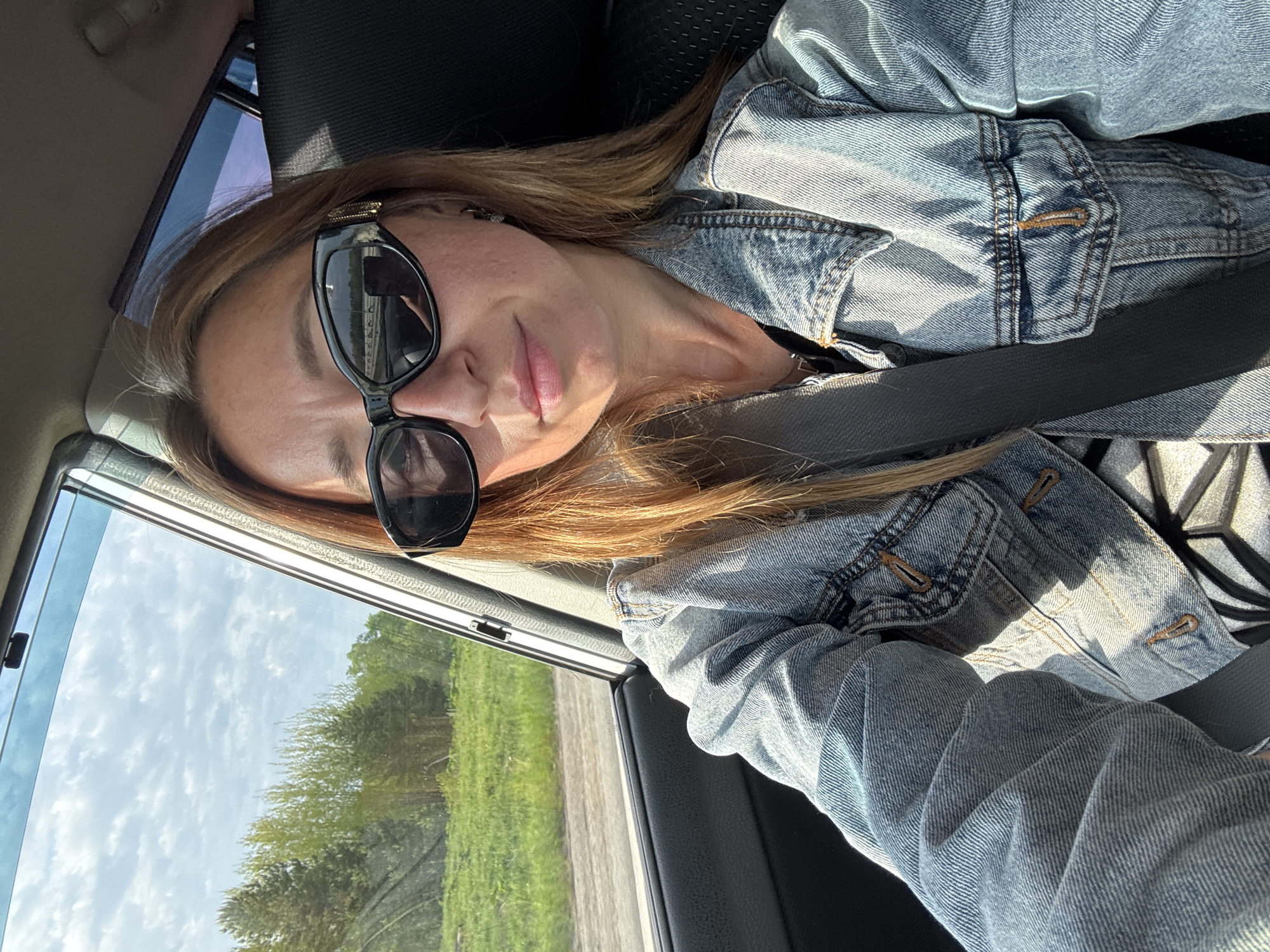 Woman travels by car near Kabanov Mys, Russia