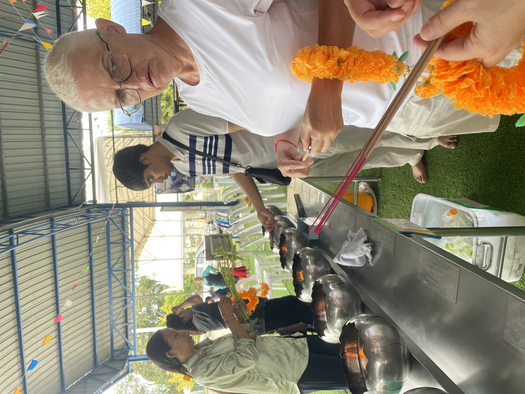 Morning temple visit: incense, offerings, and monks in coastal Chonburi