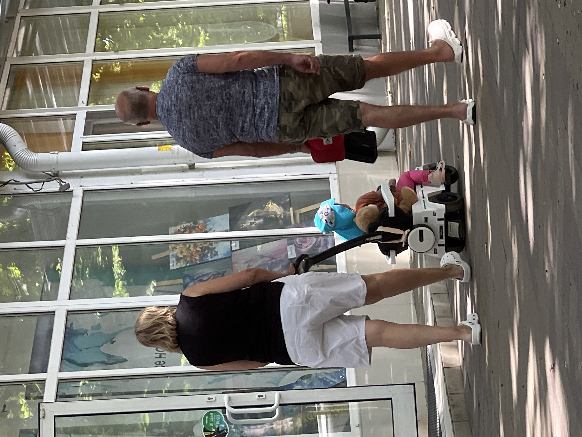 Weekday morning foot traffic along a Krasnodar commercial street