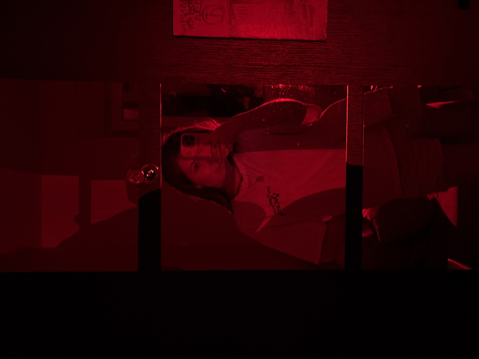 Person photographs indoor scenes with colored lighting in Belgrade