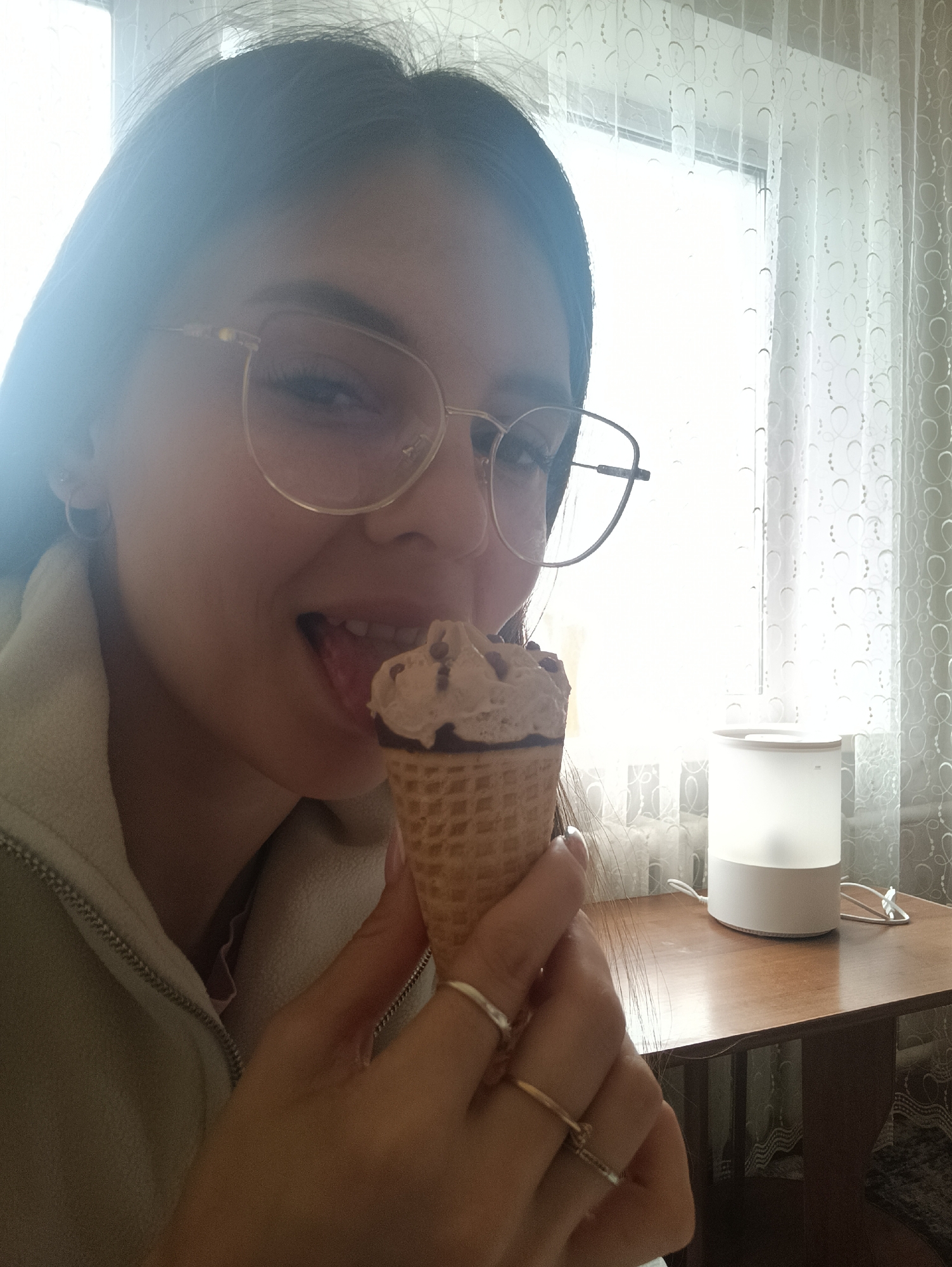 Woman enjoys ice cream indoors, captured in multiple photos