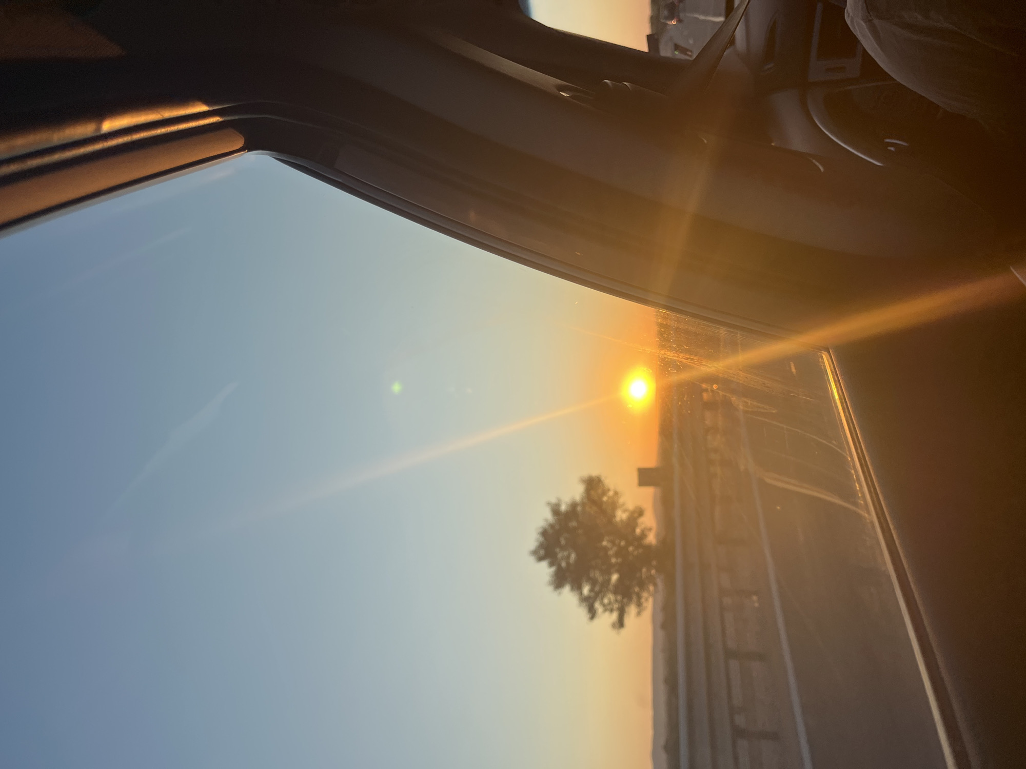 Sunset horizon seen through a car window in rural Bulgaria