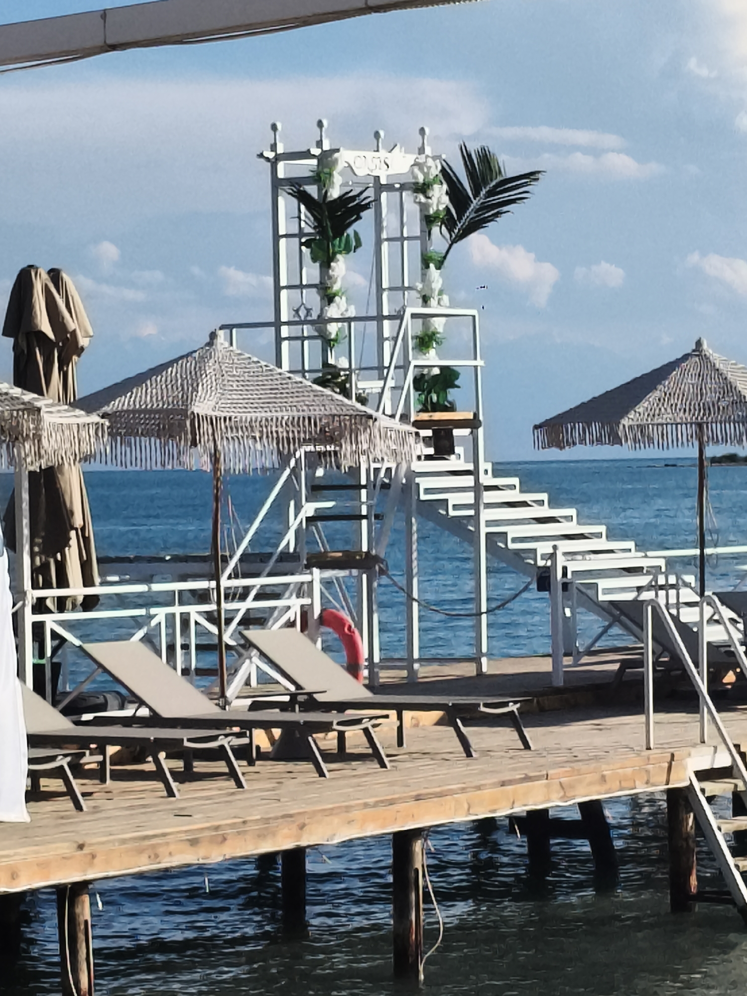 Summer afternoon on Issyk-Kul, boats and beachgoers in full swing