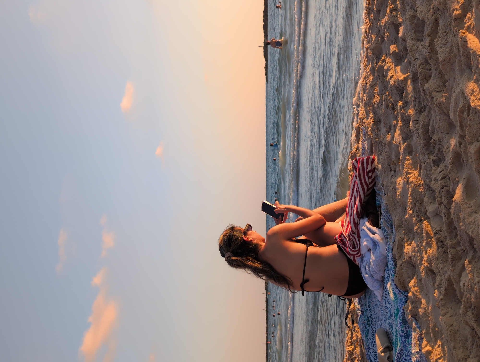 Golden hour on a Tel Aviv beach, summer afternoon.
