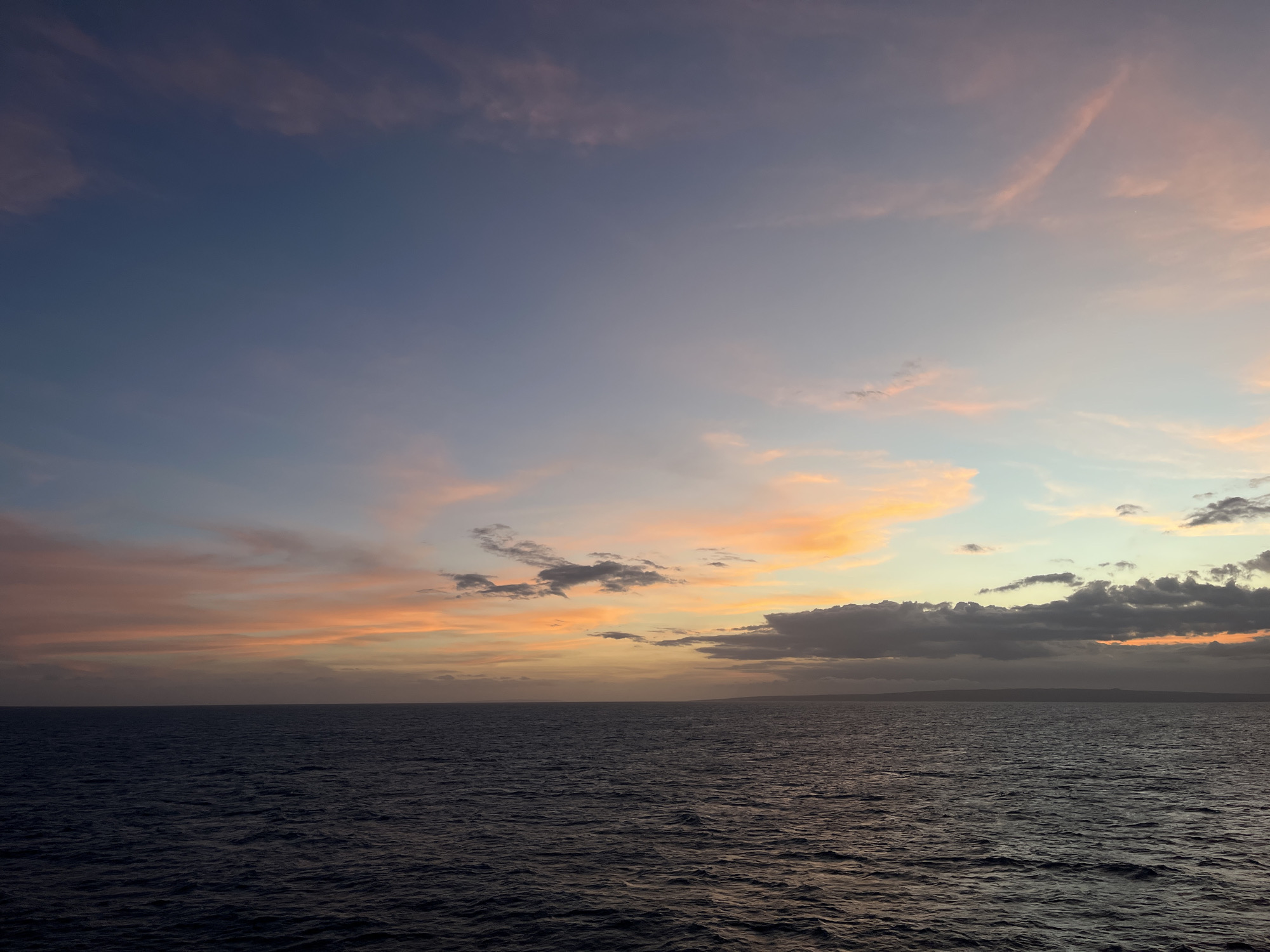 Ocean sunset captured in twilight colors by witnesses