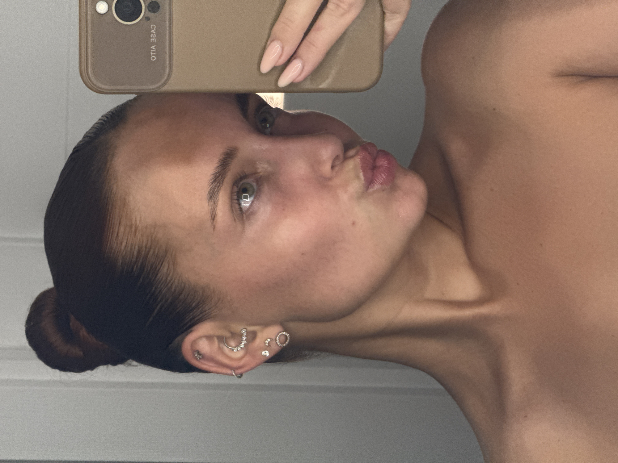 Woman takes multiple selfies in Chaikovsky, Russia evening