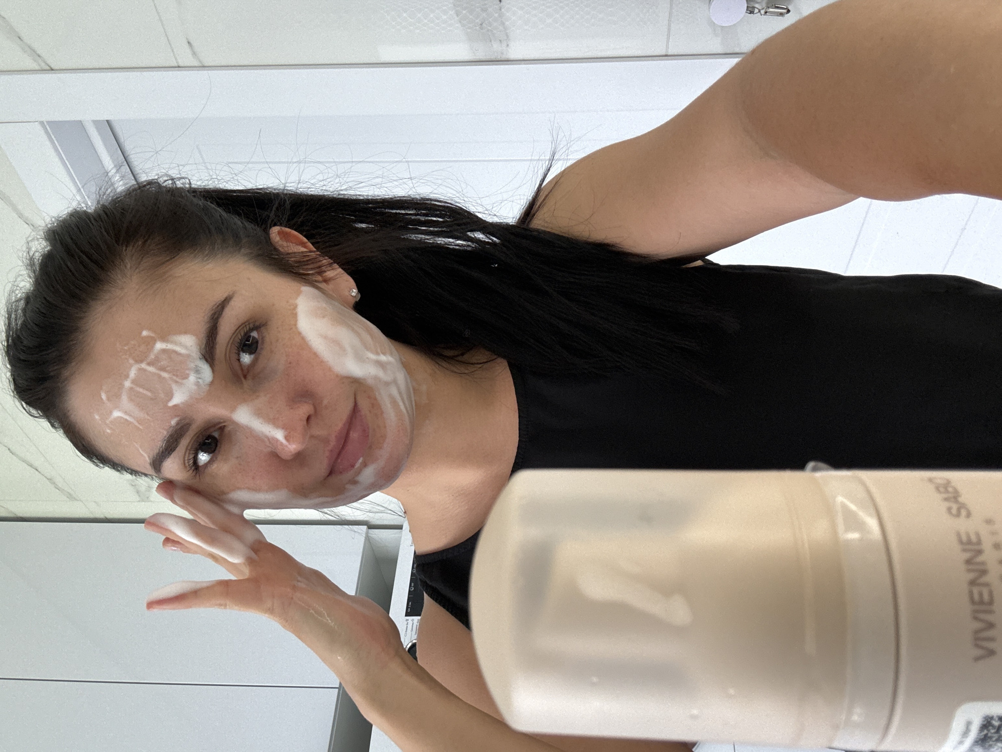 Woman documents morning skincare routine with flowers in Russia