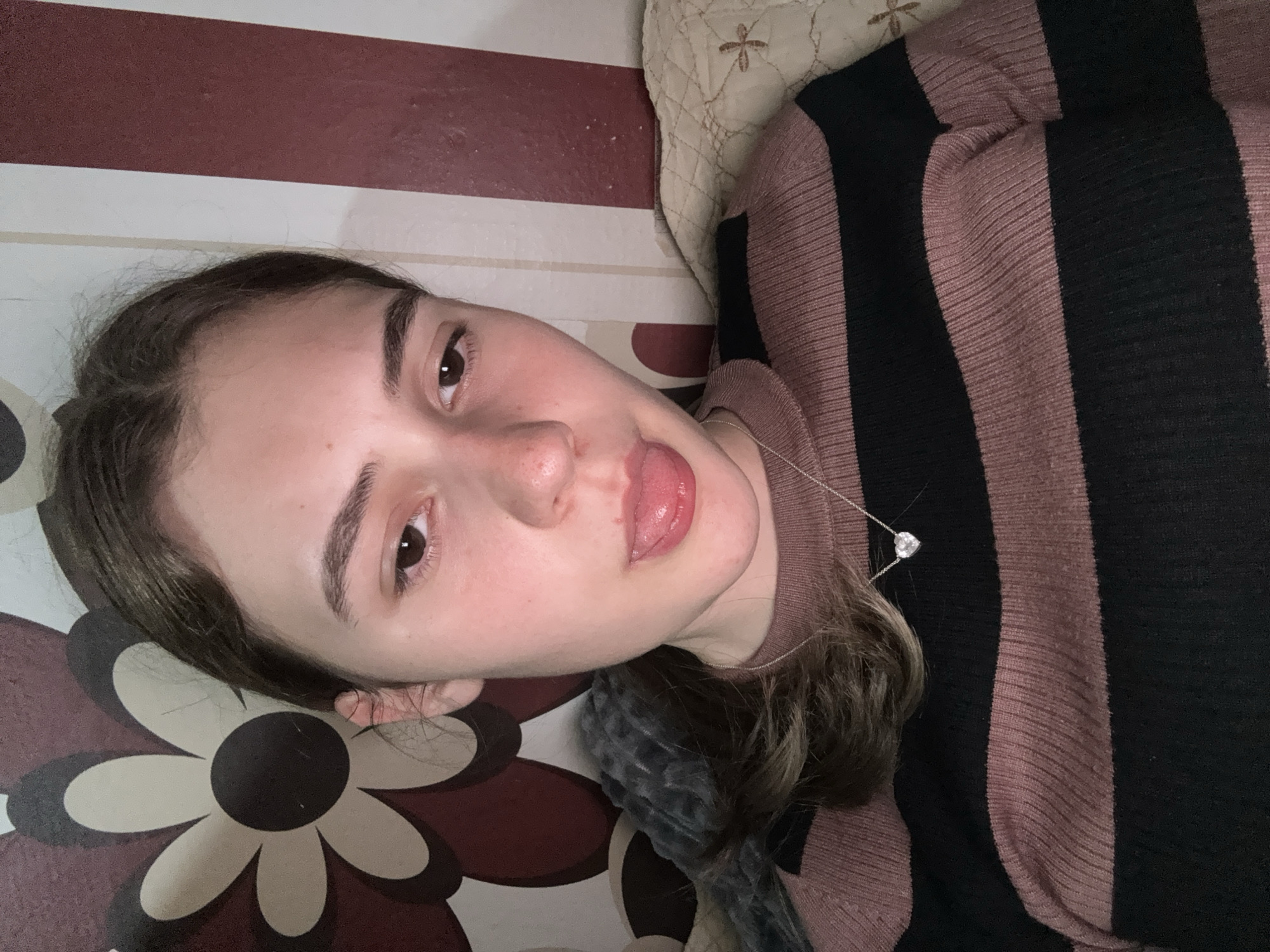 Woman makes playful expression in indoor photo, Panagyurishte