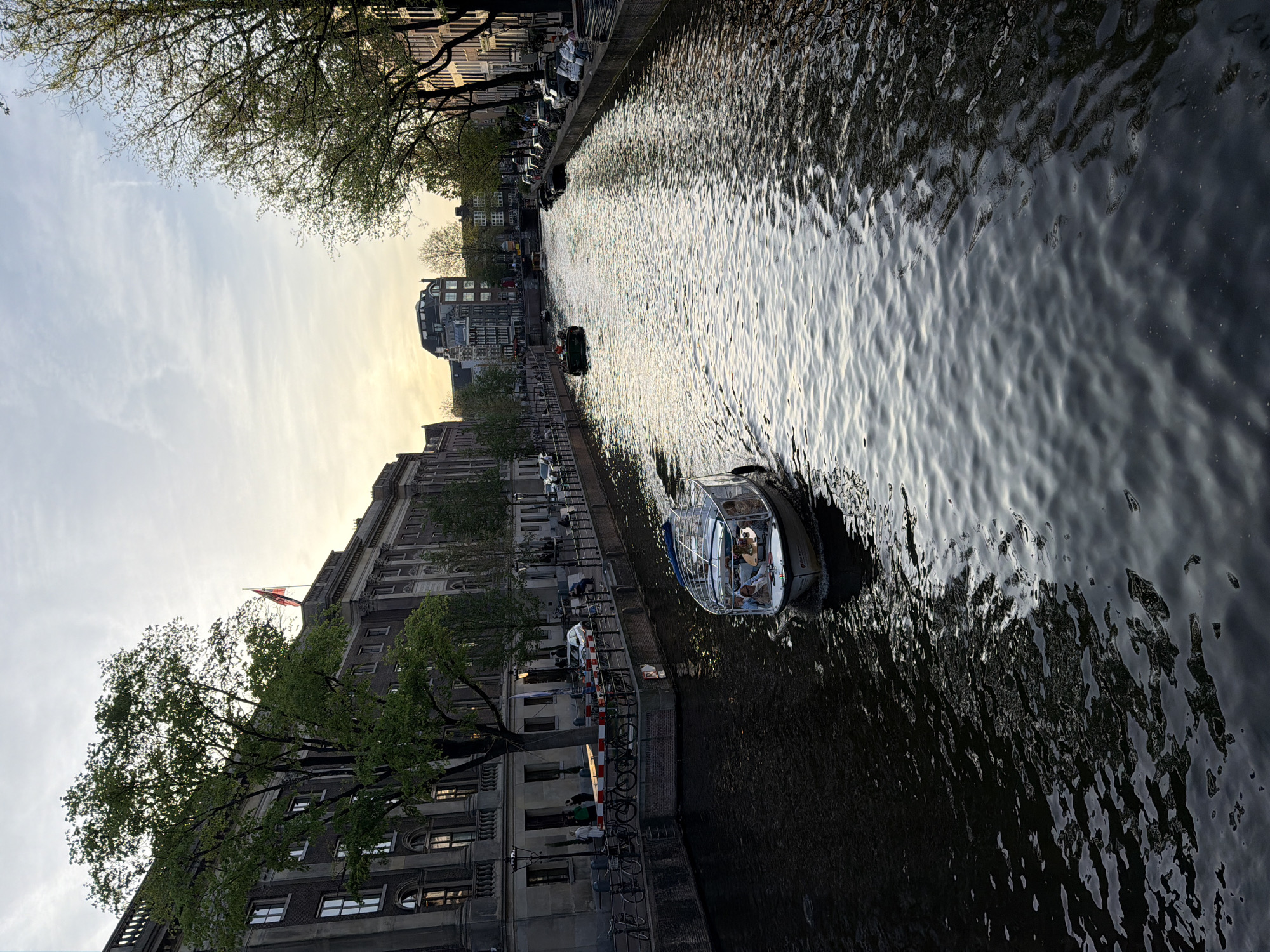 Evening canal scenes and decorated bicycle captured in Amsterdam