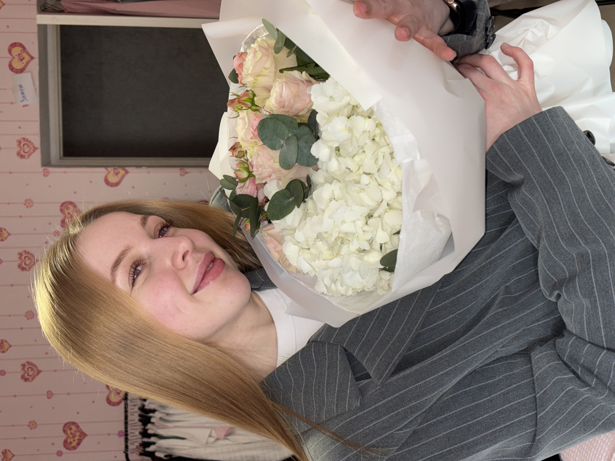 Woman poses with flower bouquet in Perm, Russia