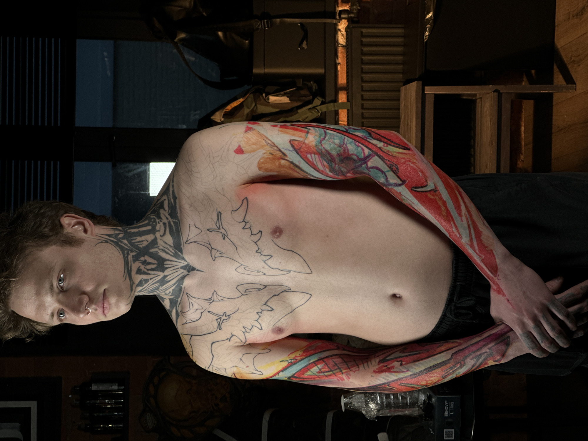 Tattooed man photographed during Moscow studio session
