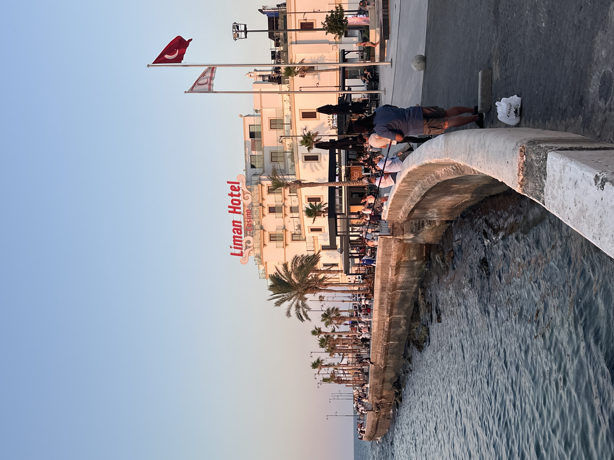 Sunset along the Kyrenia waterfront, flags and all.