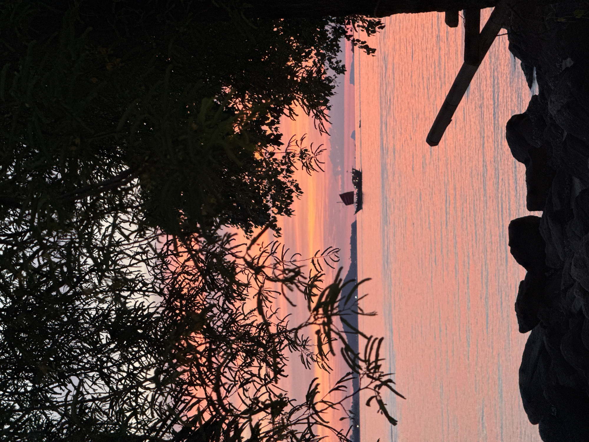 Sunset scenes along the Baan Plai Laem shoreline