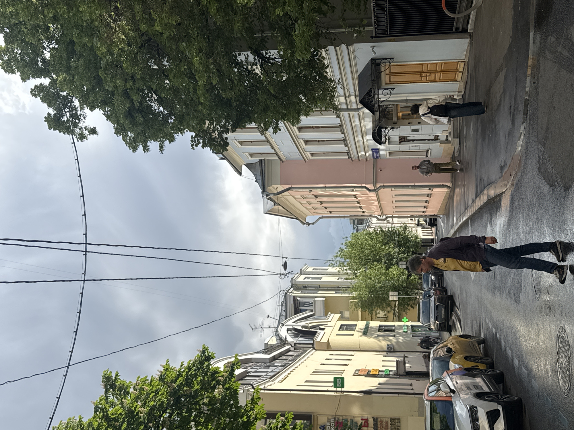 Moscow street scene shows recent rain, colorful buildings