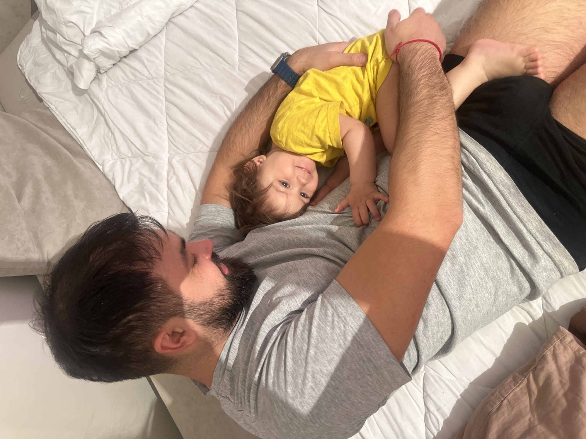 Father and toddler share quiet moment in Gavrilkovo