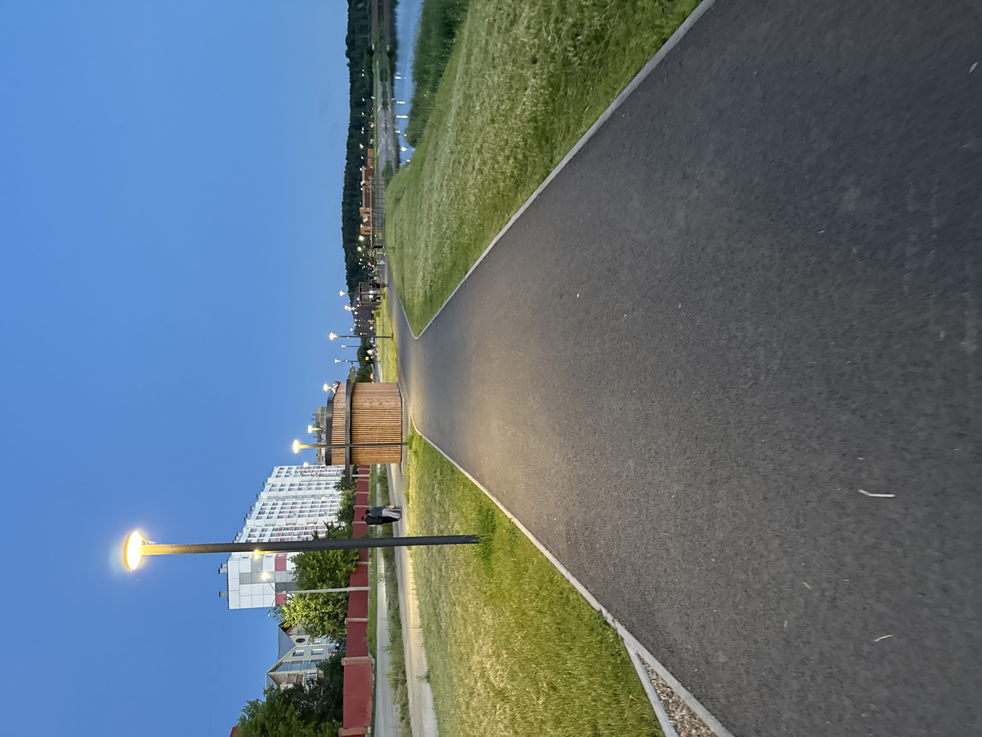 Summer evening along the Miass lakefront park and promenade