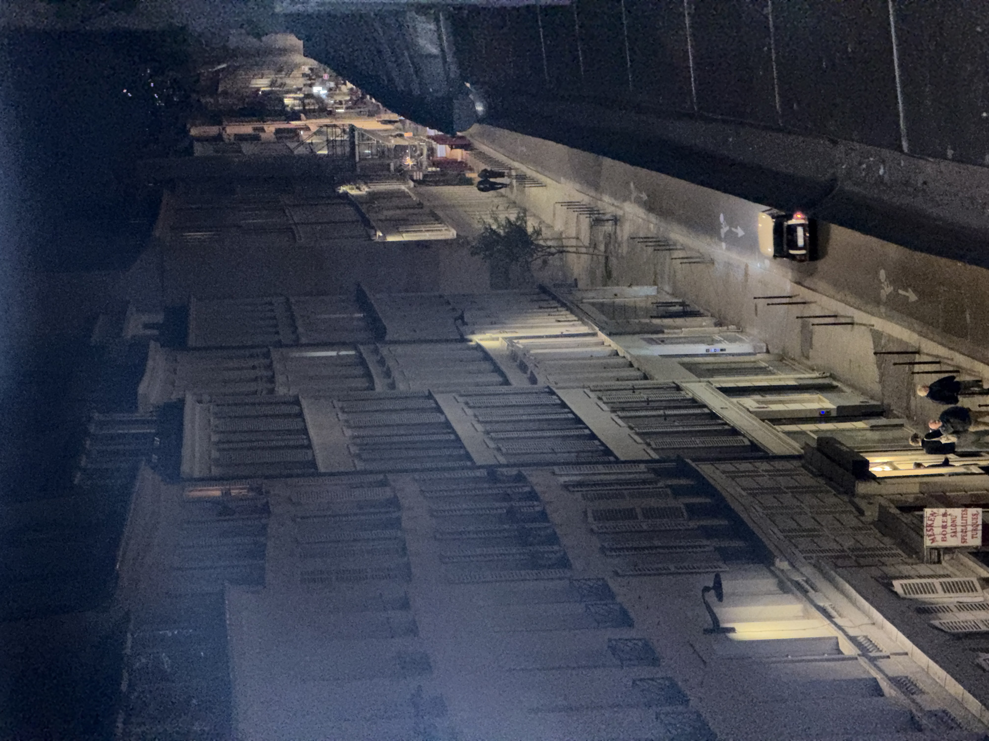 Nighttime street life and partial eclipse observed in Paris