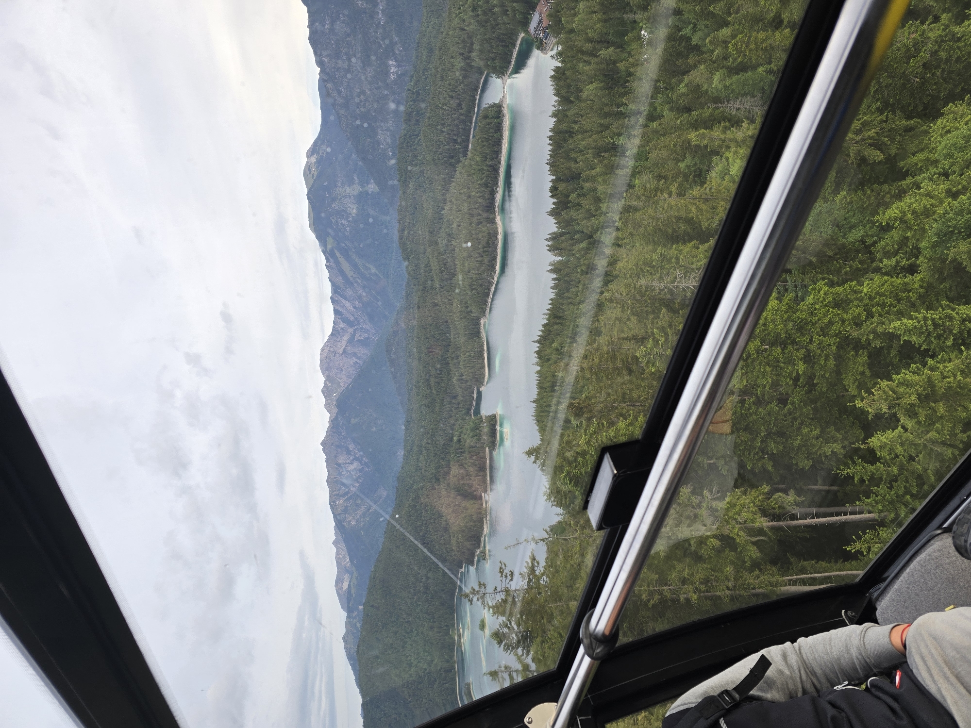 Cable car passenger photographs Eibsee Alpine landscape in Grainau