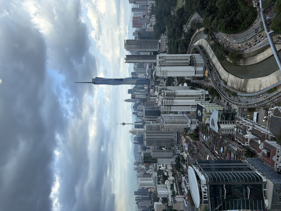 Tourists enjoy infinity pool with Kuala Lumpur city views