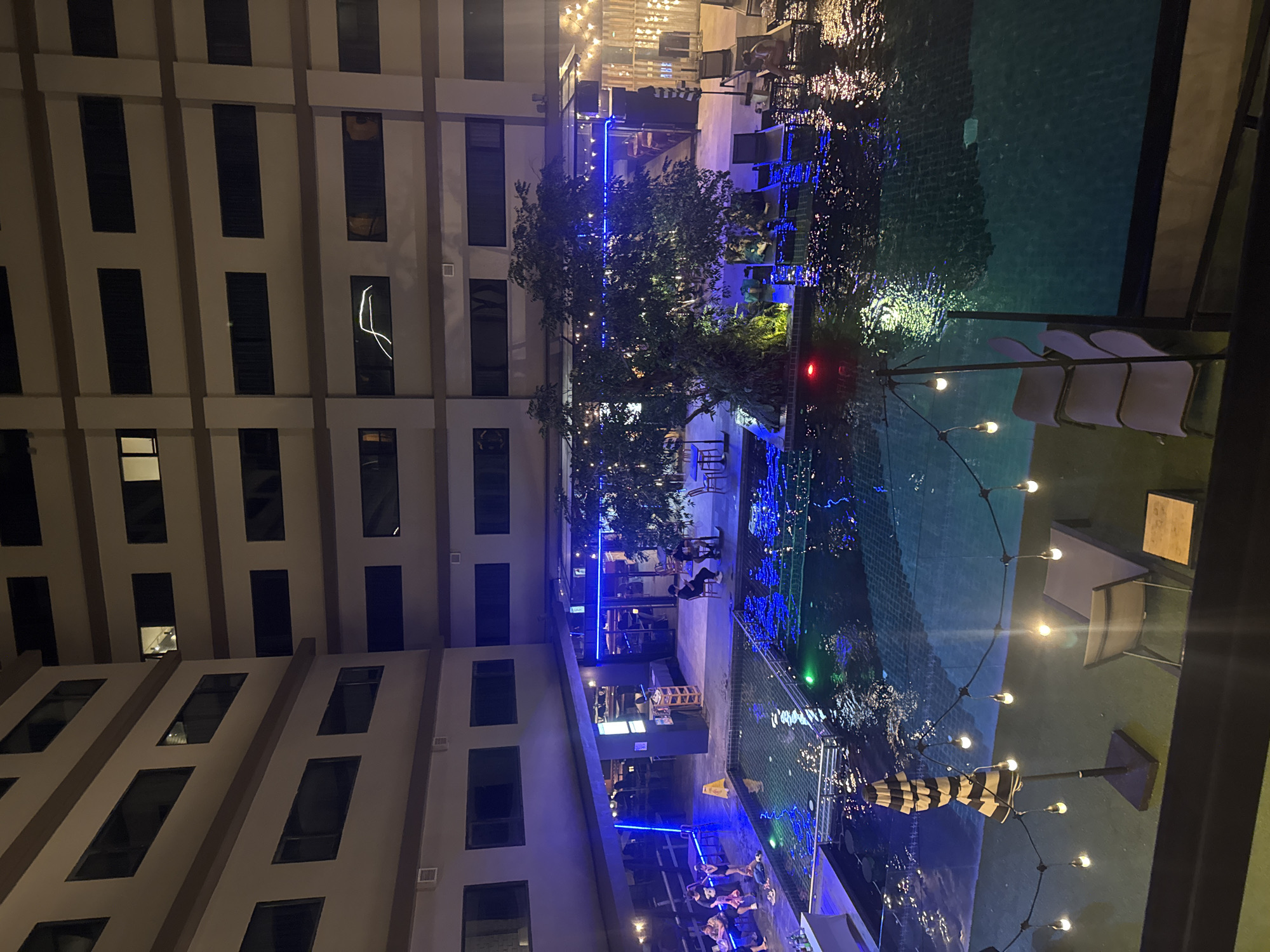 Hotel courtyard pool shot from above at night