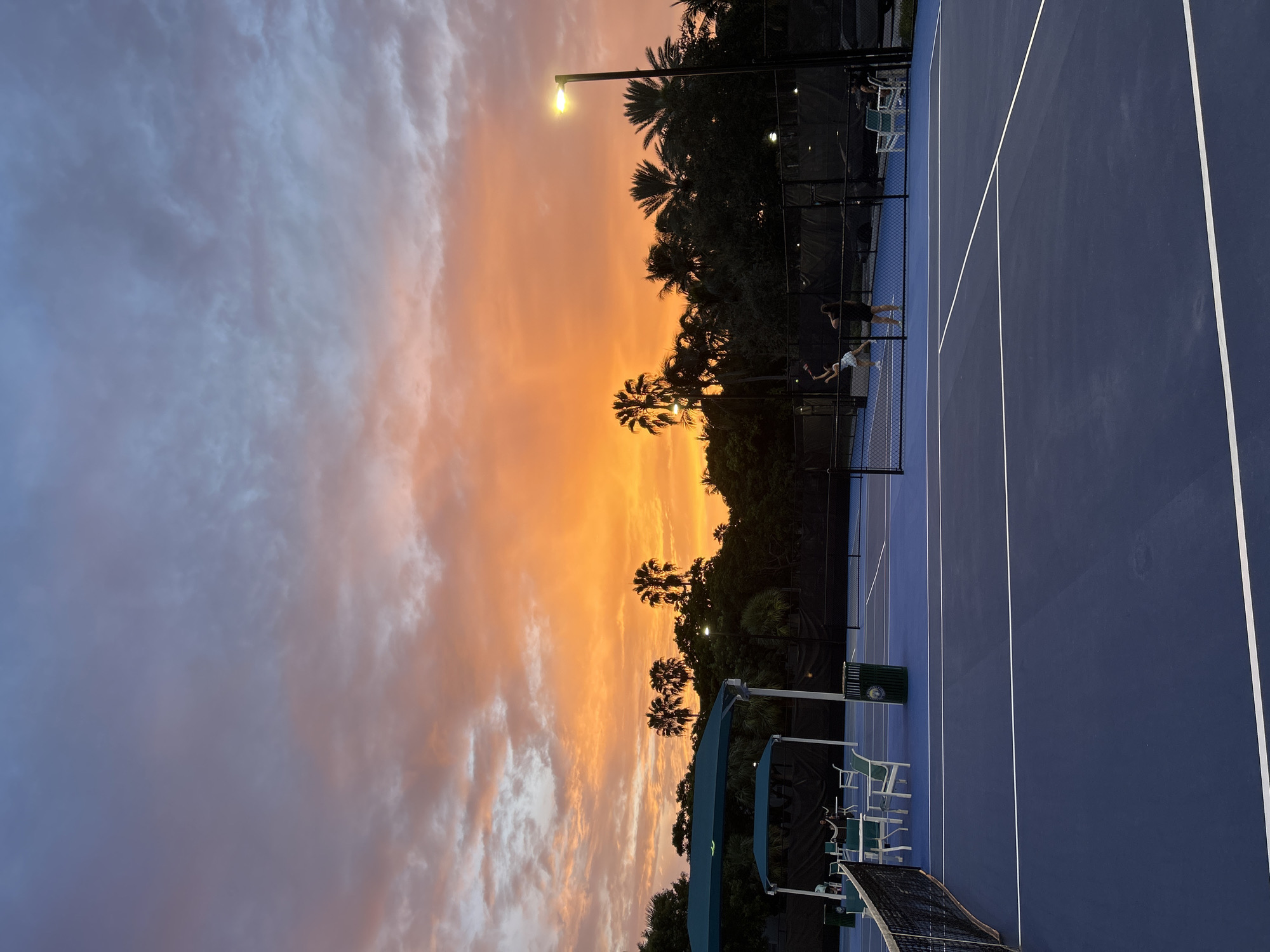 Tennis match under a vivid South Florida sunset in Aventura