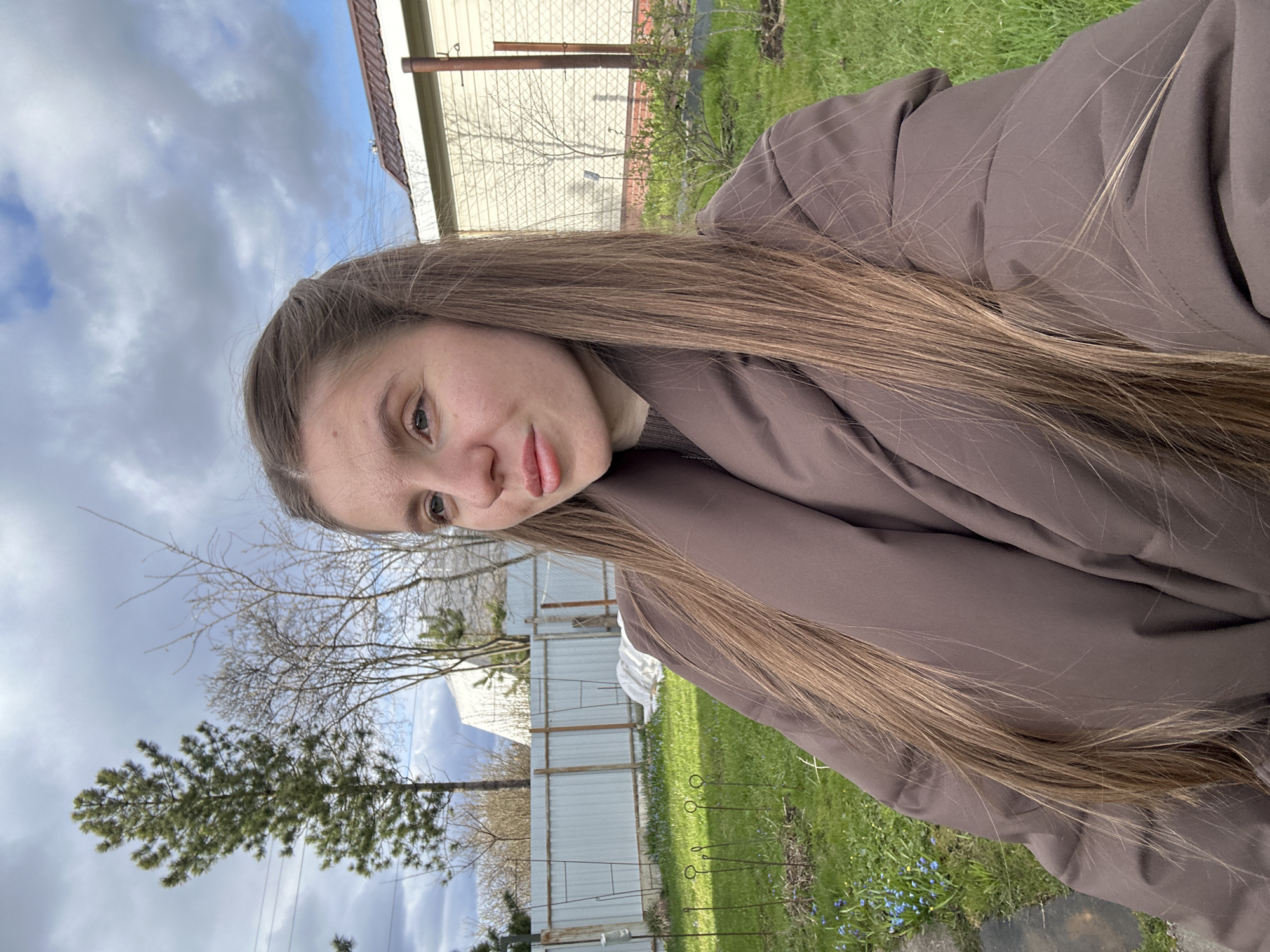 Woman takes selfies outdoors in Klin, Russia with toddler