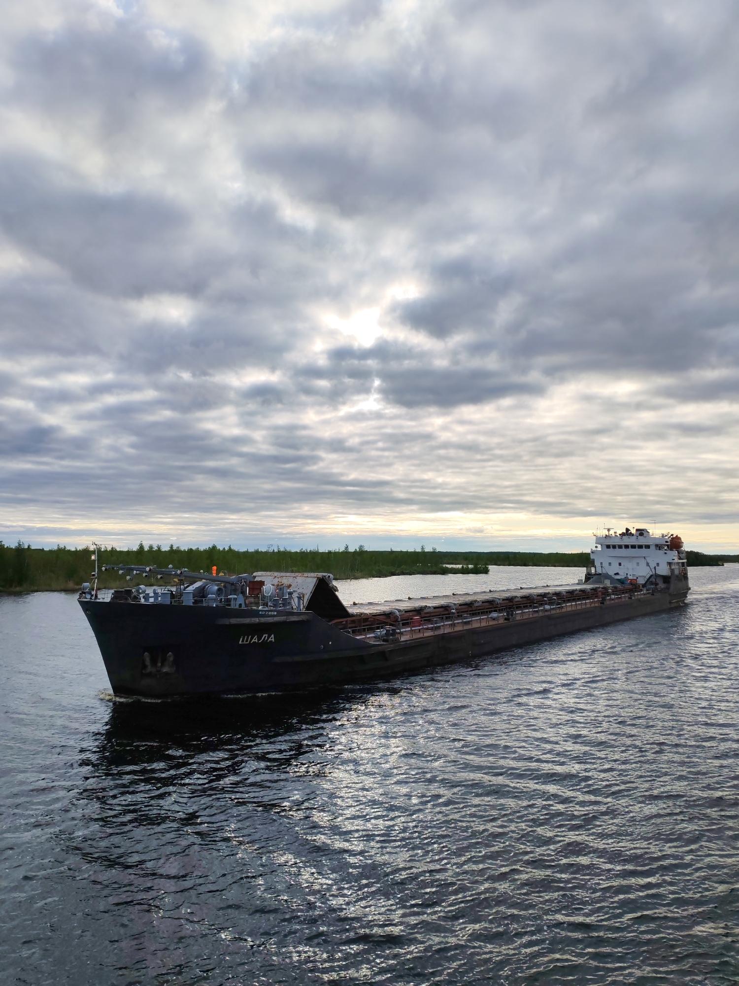 Cargo barges transport construction materials on Russian waterways