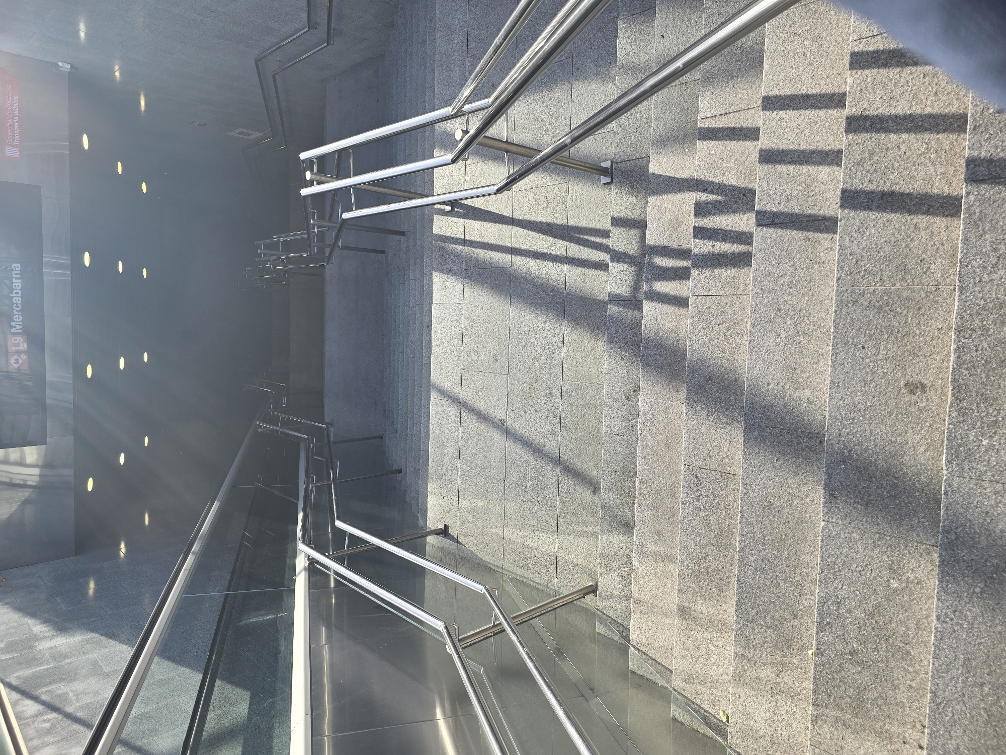 Empty Barcelona metro station staircase captured by witness