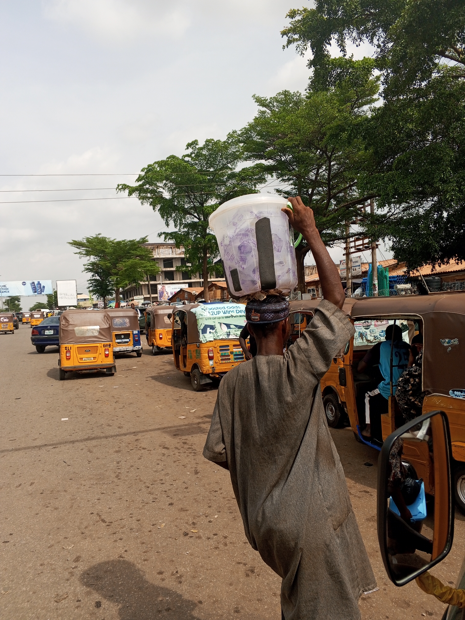 Street vendors conduct daily business in Abuja marketplace