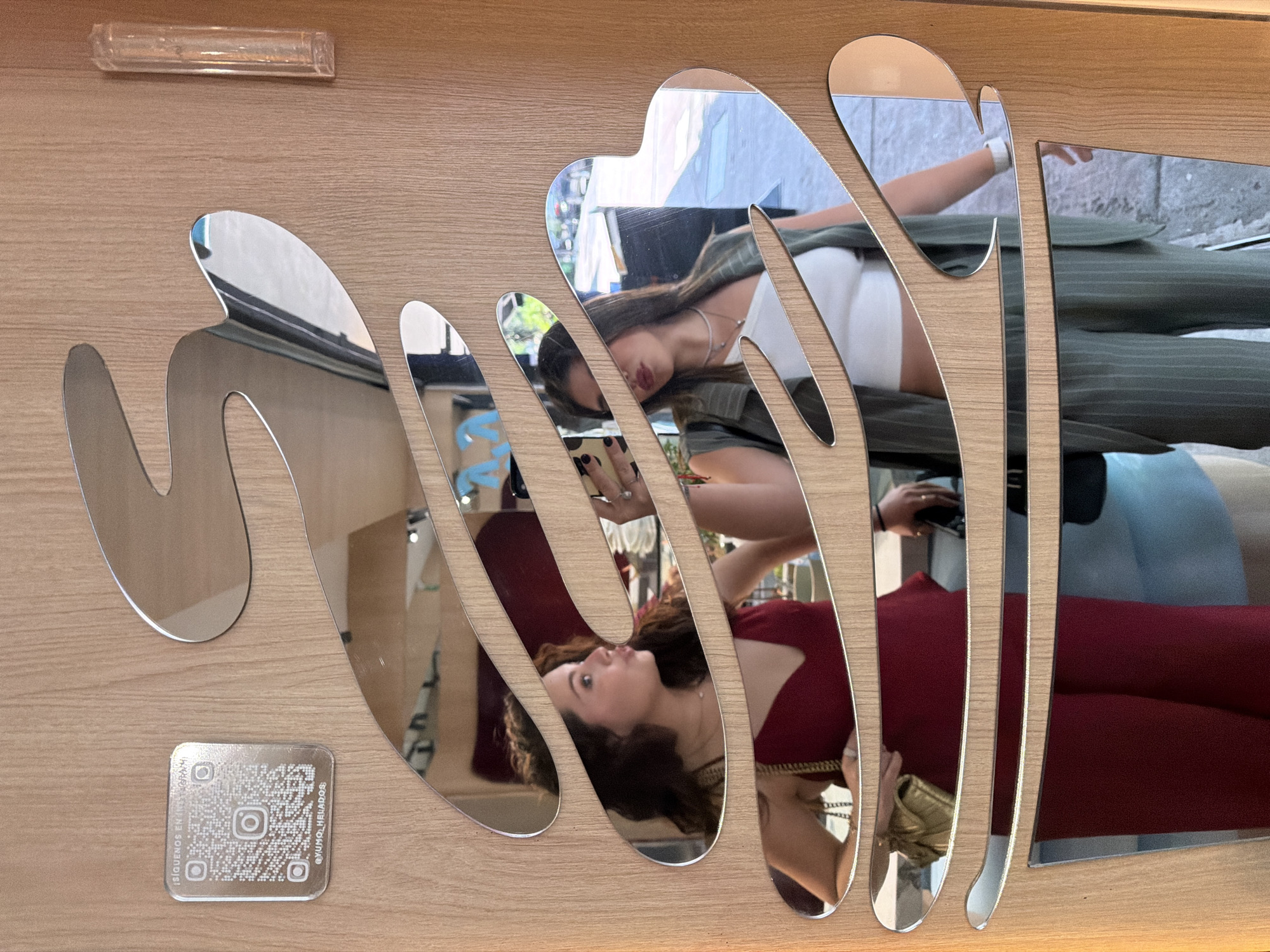 Friends document ice cream shop visit with mirror selfies