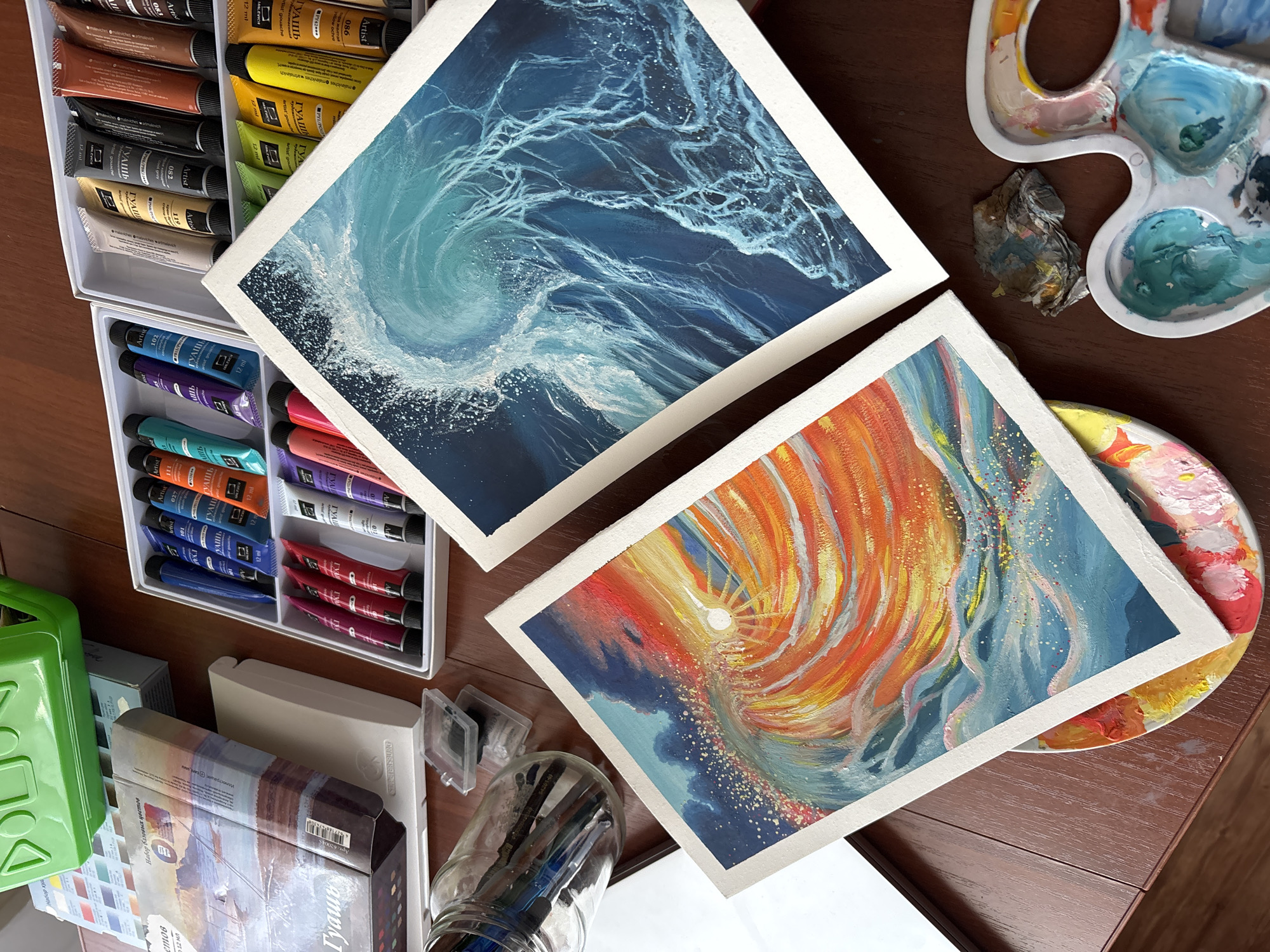 Artist workspace documented in Izhevsk showing completed vortex paintings