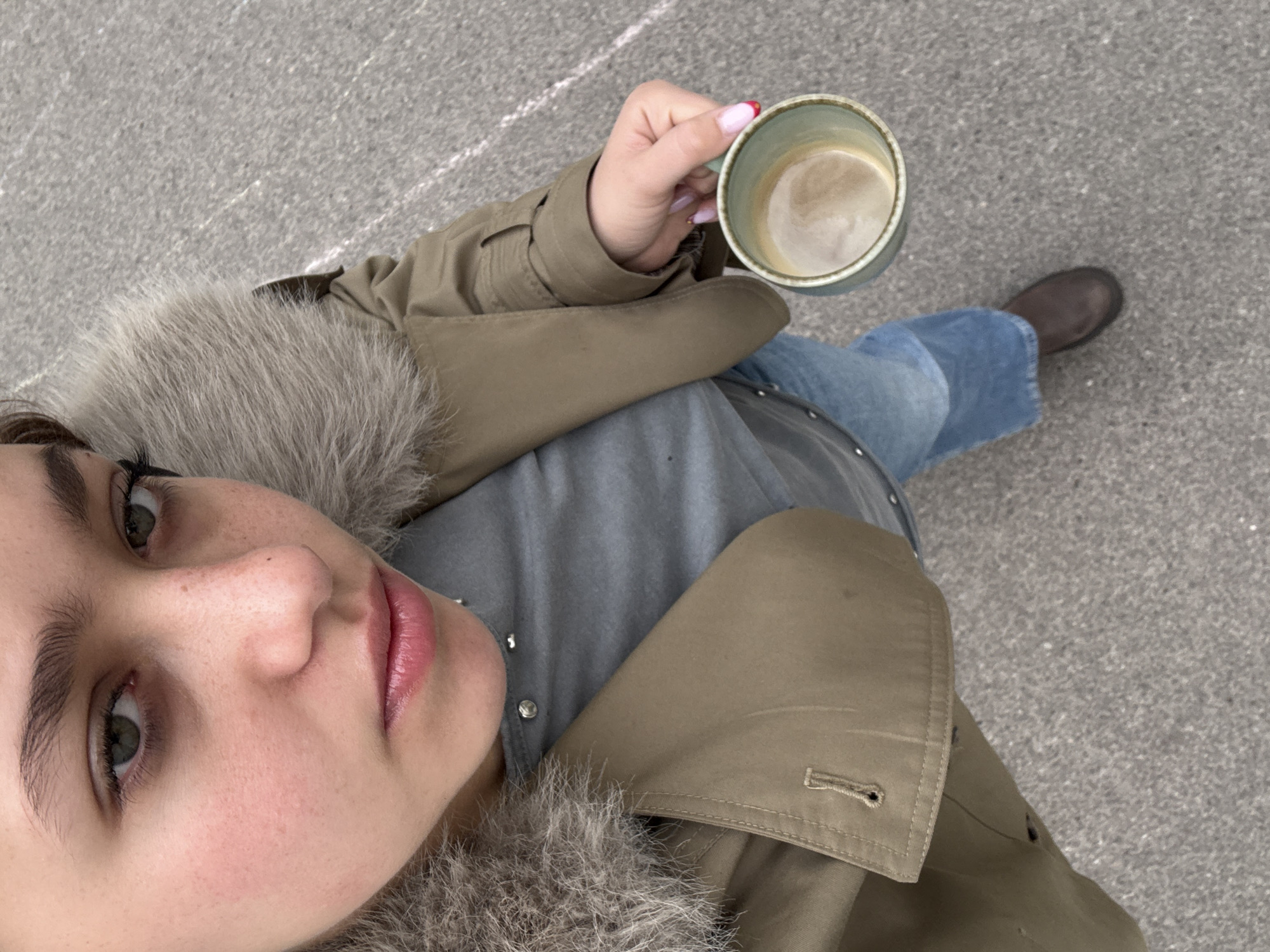 Morning selfie captured in Vienna with coffee mug