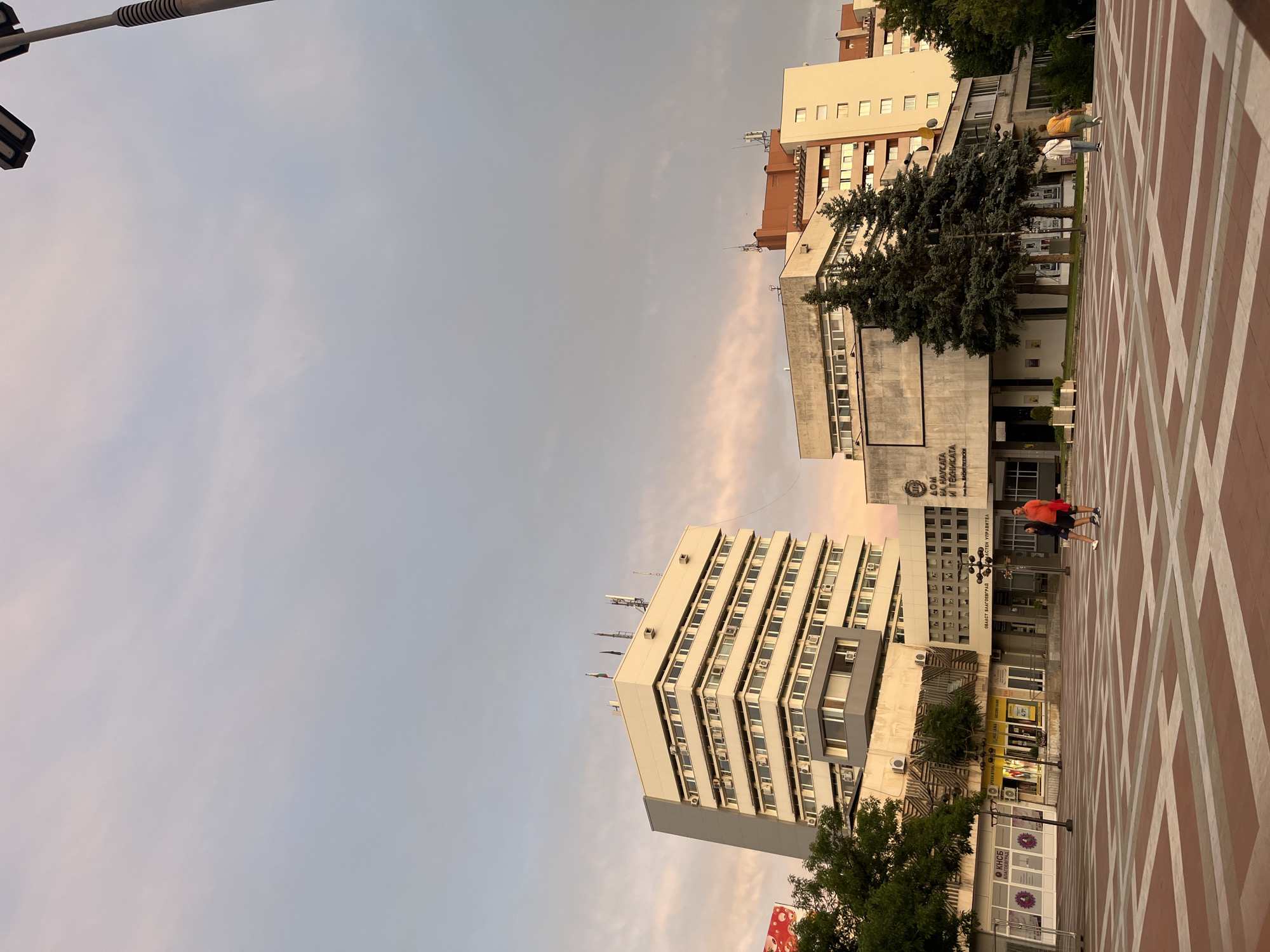 Dusk at a city plaza near the Nikola Vaptsarov Drama Theatre